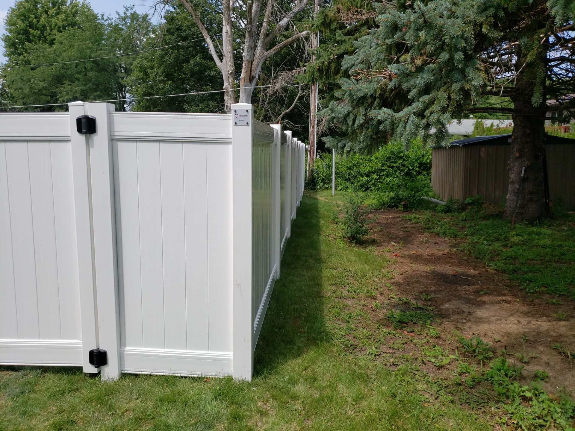 White Vinyl Privacy Fence Installation in Grundy Center by Perfect Picket Fence and Stain