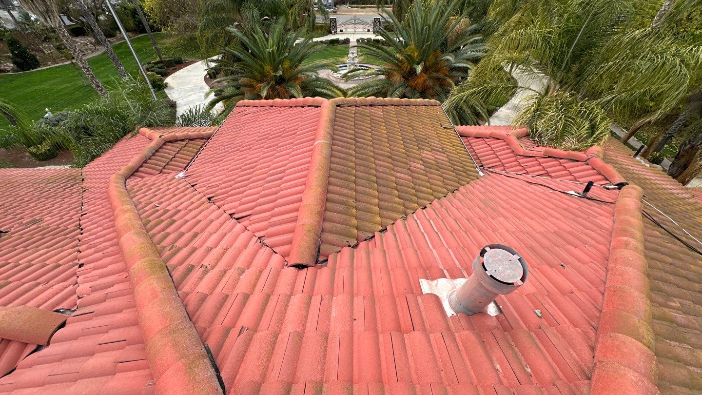 Tile refurbish project using existing tiles and replaced underlayment and battens by Straight Edge Roofing Inc