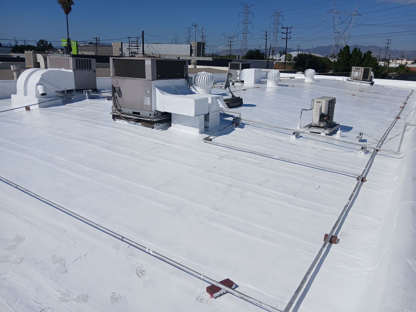 Silicone Application Project on a Commercial Property by Hull Brothers Roofing