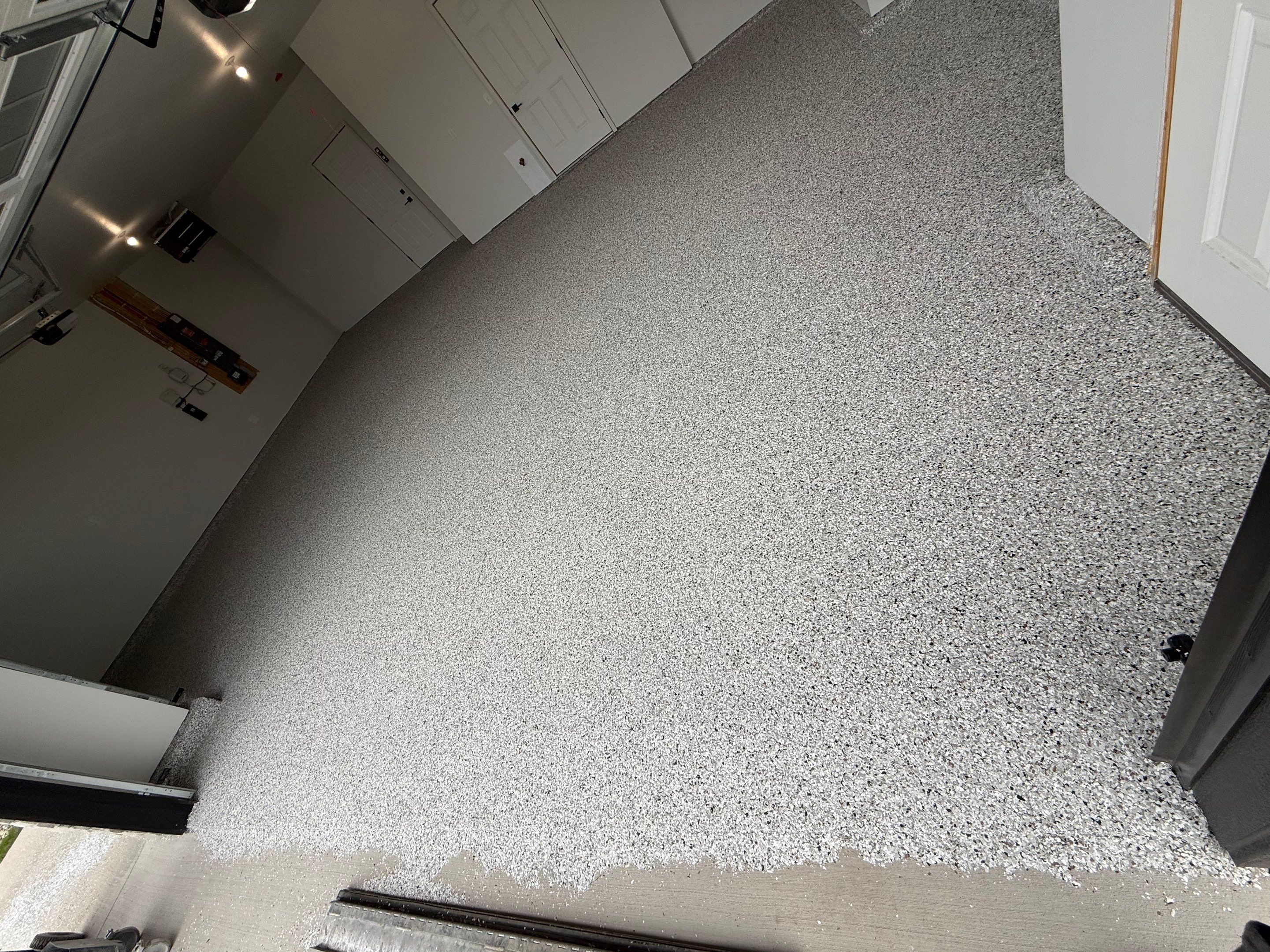 High-Gloss Epoxy Flake Garage Floor Coating in Brandon by Select Painting, Coatings & Garage Cabinets