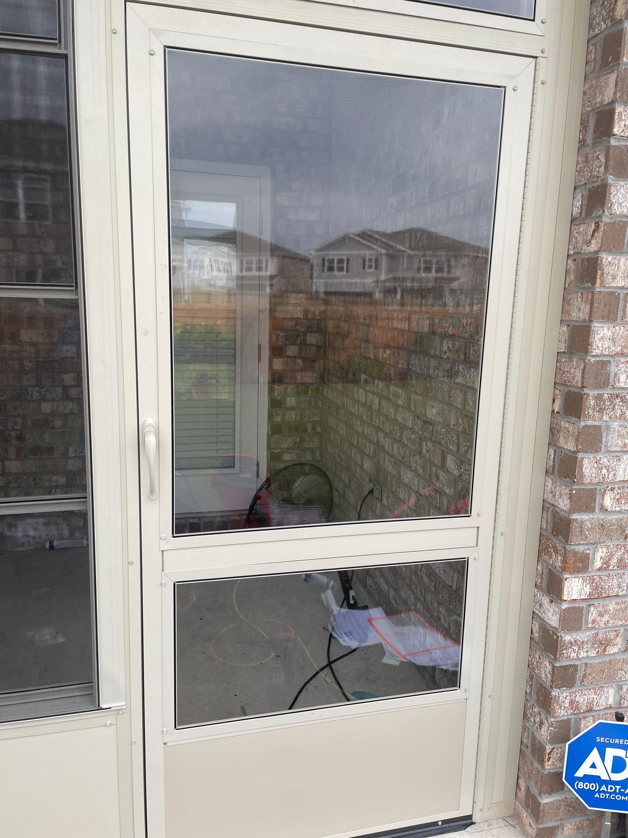 Panama City Glass Room Under Existing Patio Cover by Titan Sunrooms