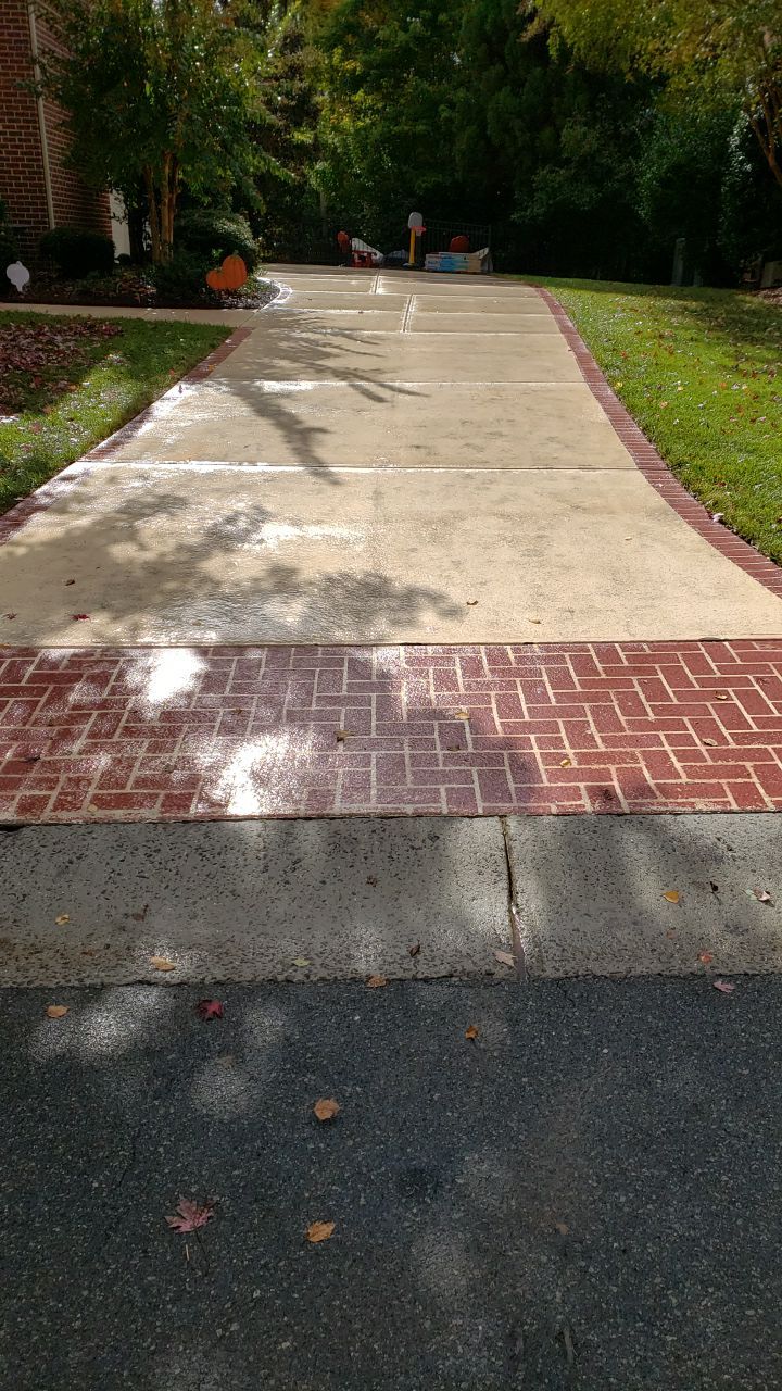Driveway Clean using cleaner by Power Wash Masters LLC