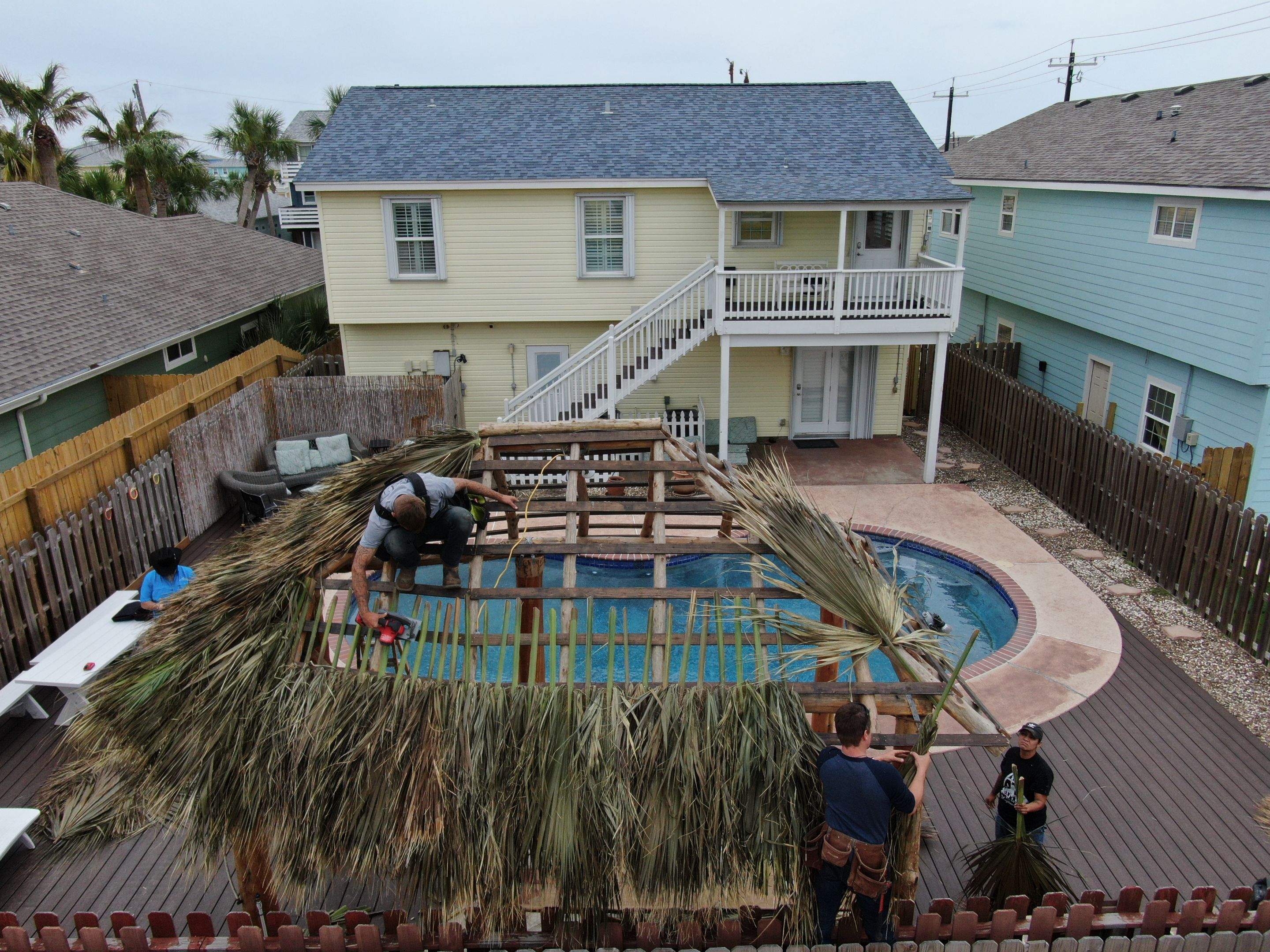 Poolside paradise by Bayfront Roofing and Construction