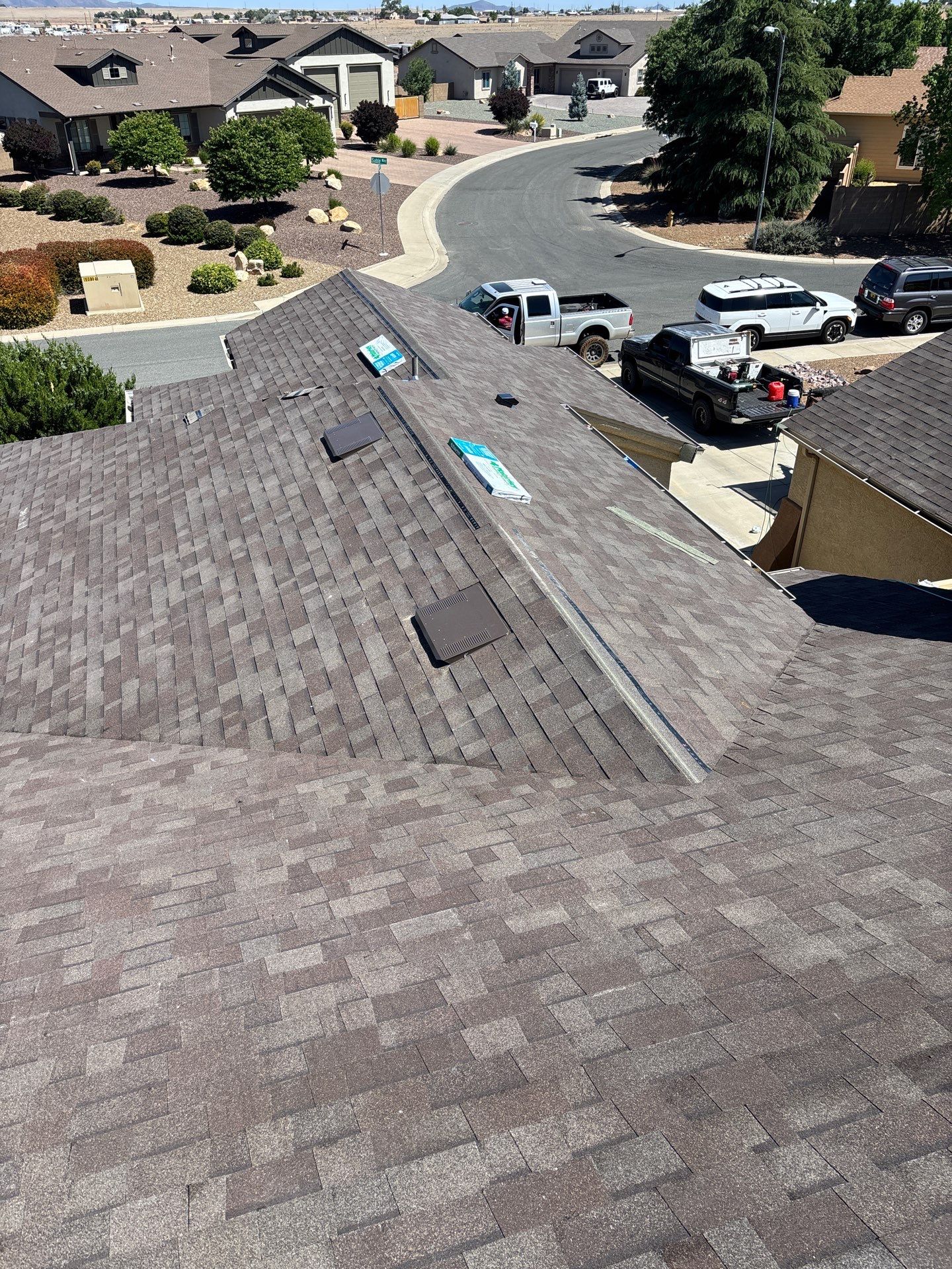 Residential Roofing Installation with Architectural Shingles and Turret Detail by Badger Roofing