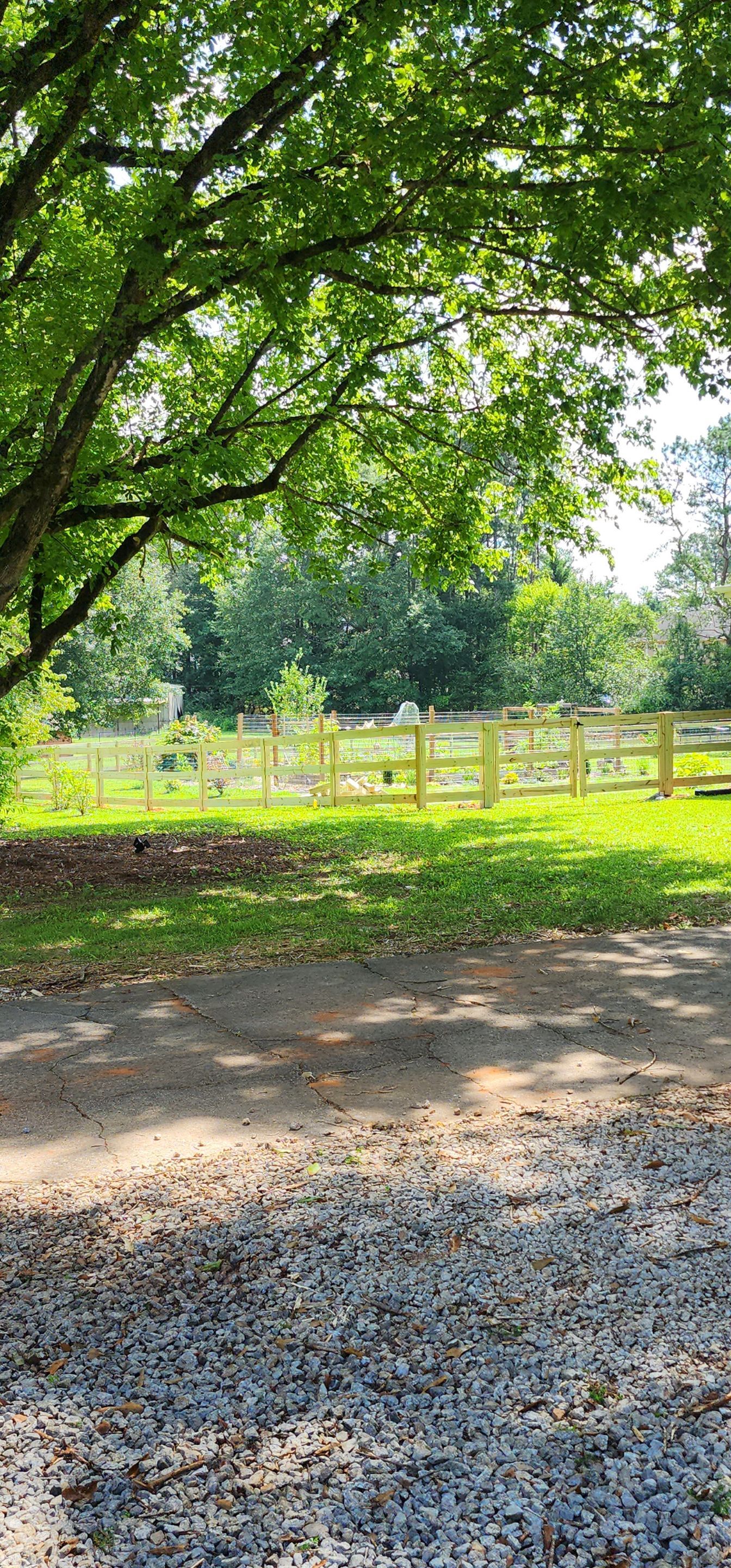 Fence Installation of 3 Rail Ranch with Wire Backing by Titans of Timber Fence & Stain