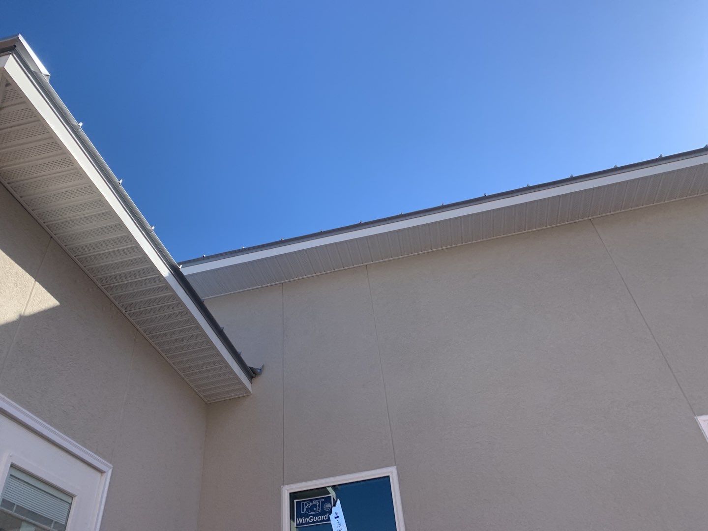 Soffit and Fascia Installation using White Vinyl Soffit in Pensacola FL by Gutter Professors