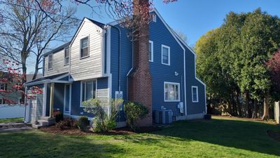 James Hardie siding, new metal roof and couple windows being installed.