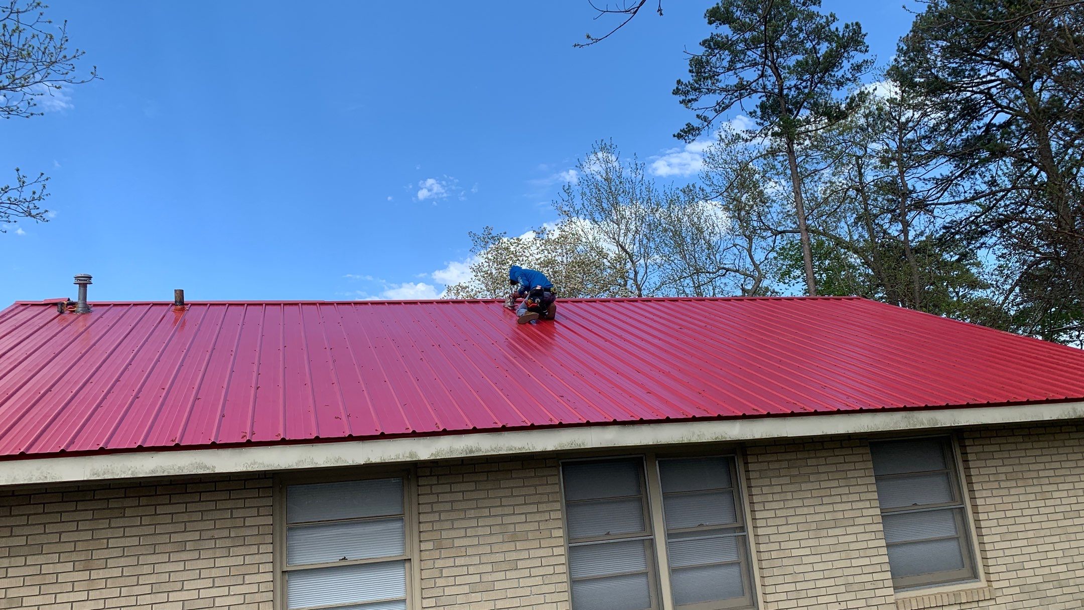 Residential Roofing Installation using 26 Gauge Colored Panels by Hostetler Roofing