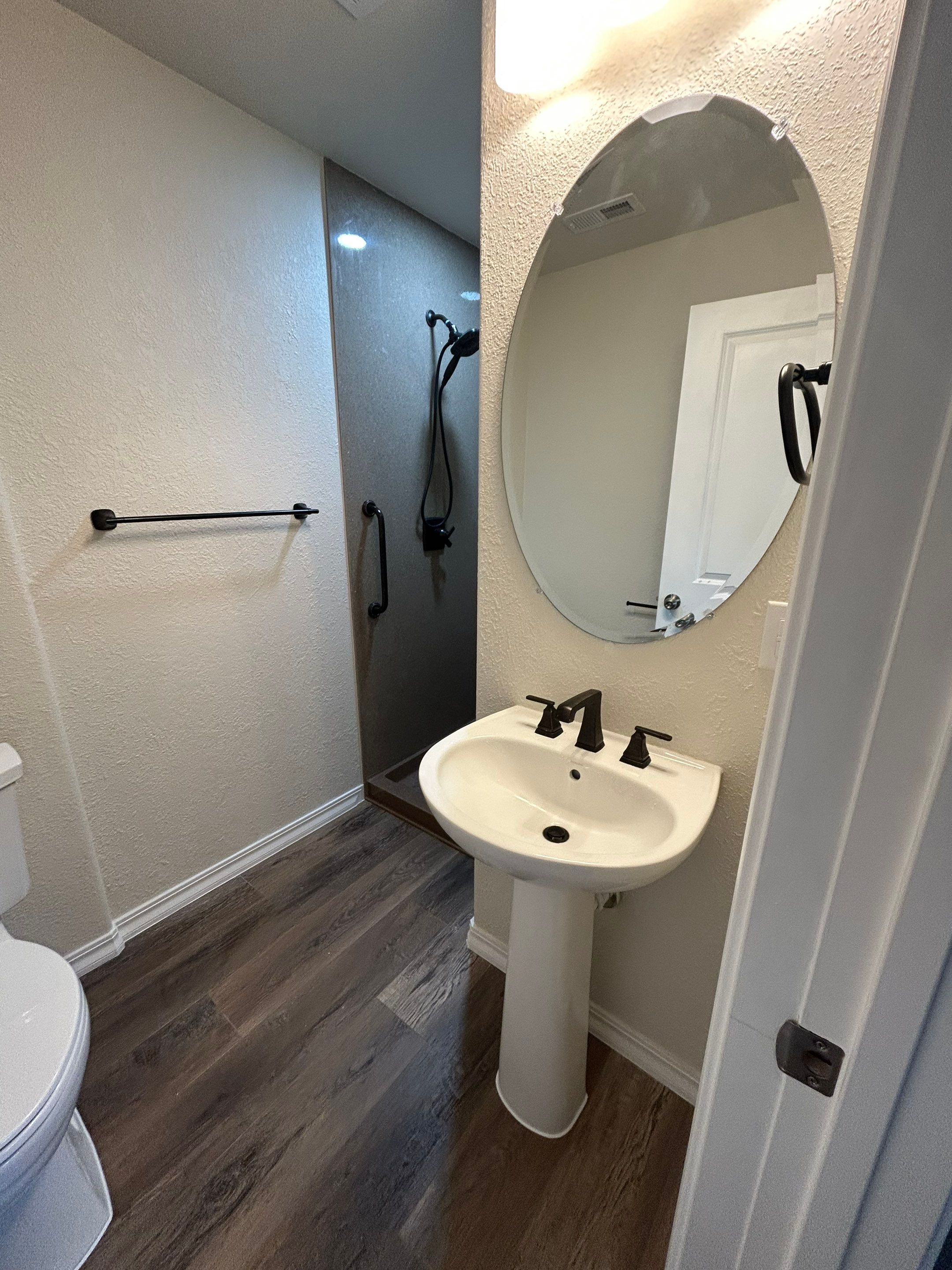 Shower Addition to Powder Room  by Center Point Renovations