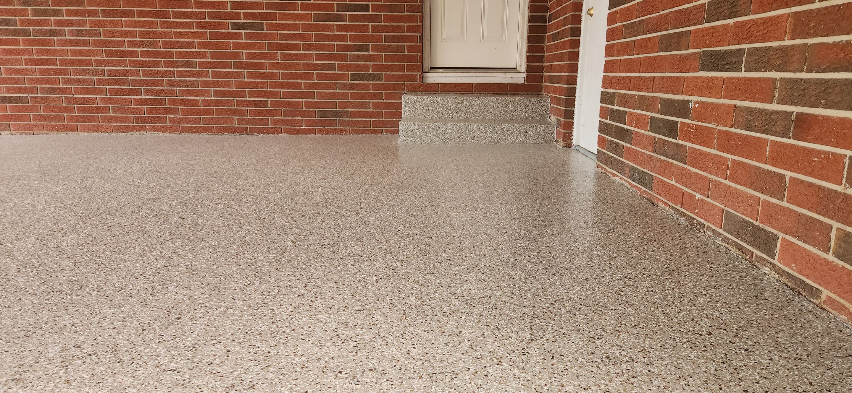 Back Patio using Creekbed by Elite Floor Solutions