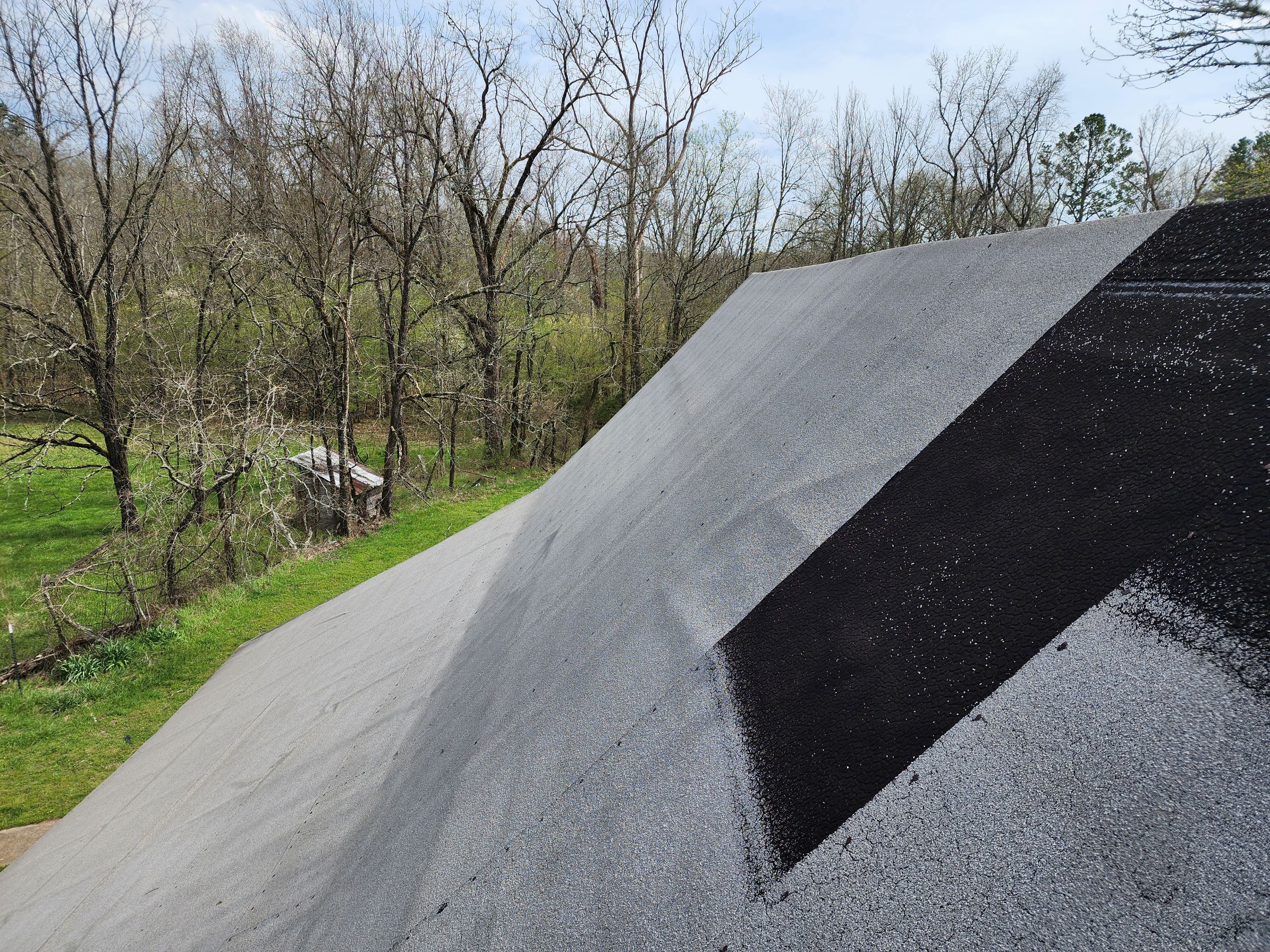 Residential Roofing Installation using 26 Gauge Colored Panels by Hostetler Roofing