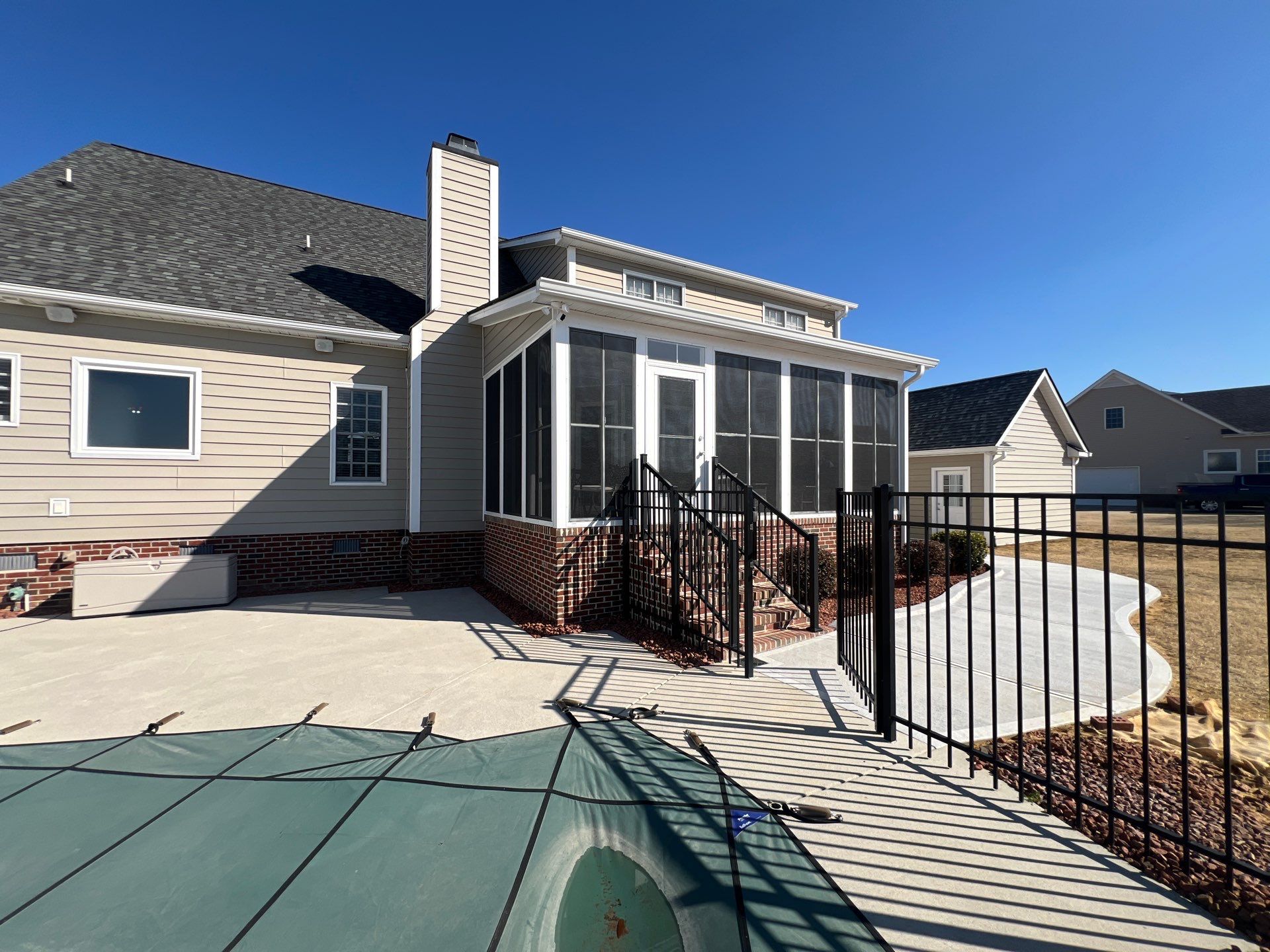 Custom Screened Porch and Concrete Walkway Installation in Rocky Mount by The Remodeling Company