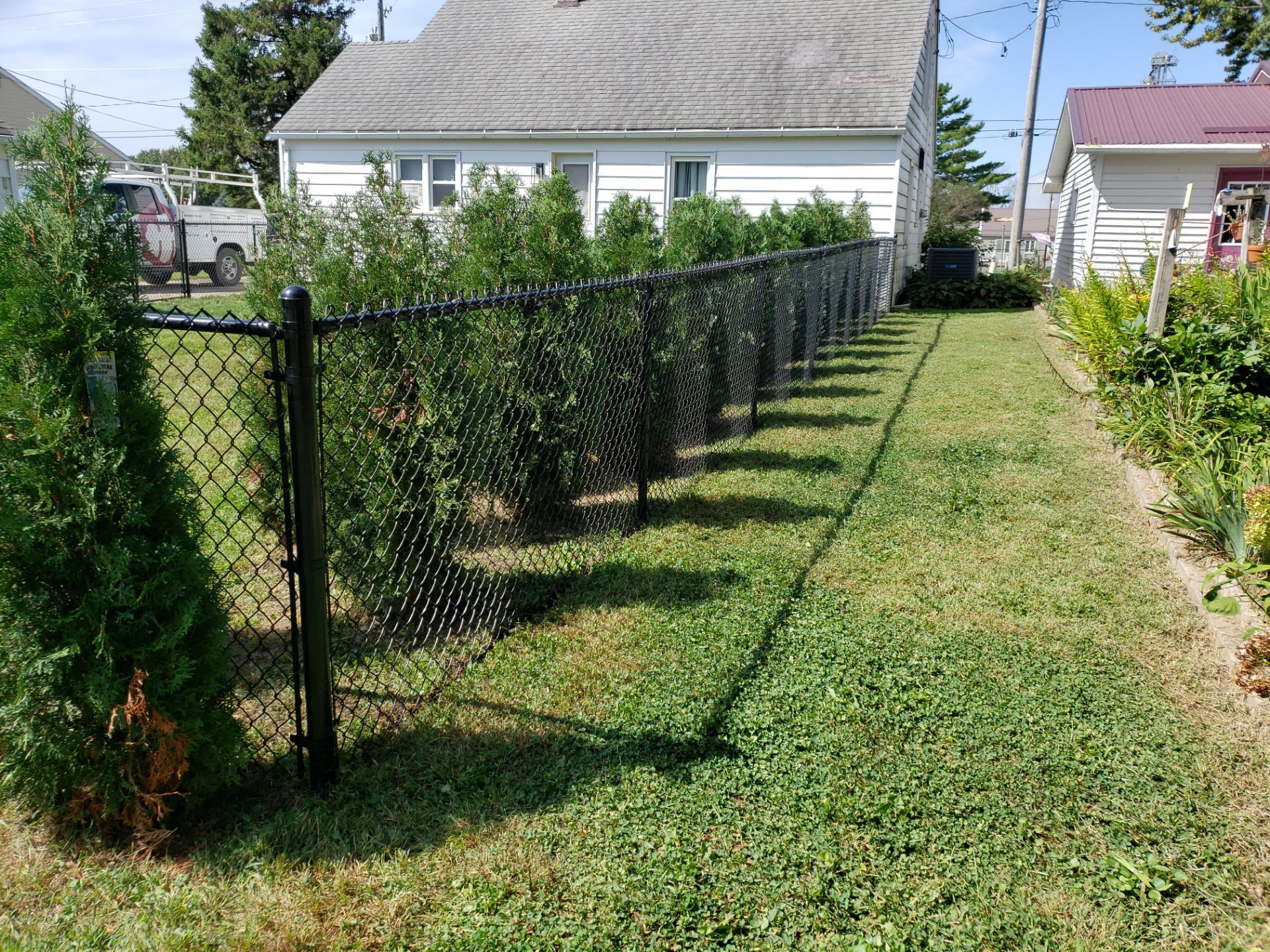 Residential Black Chain Link Fencing Project in Wellburg, Iowa by Perfect Picket Fence and Stain