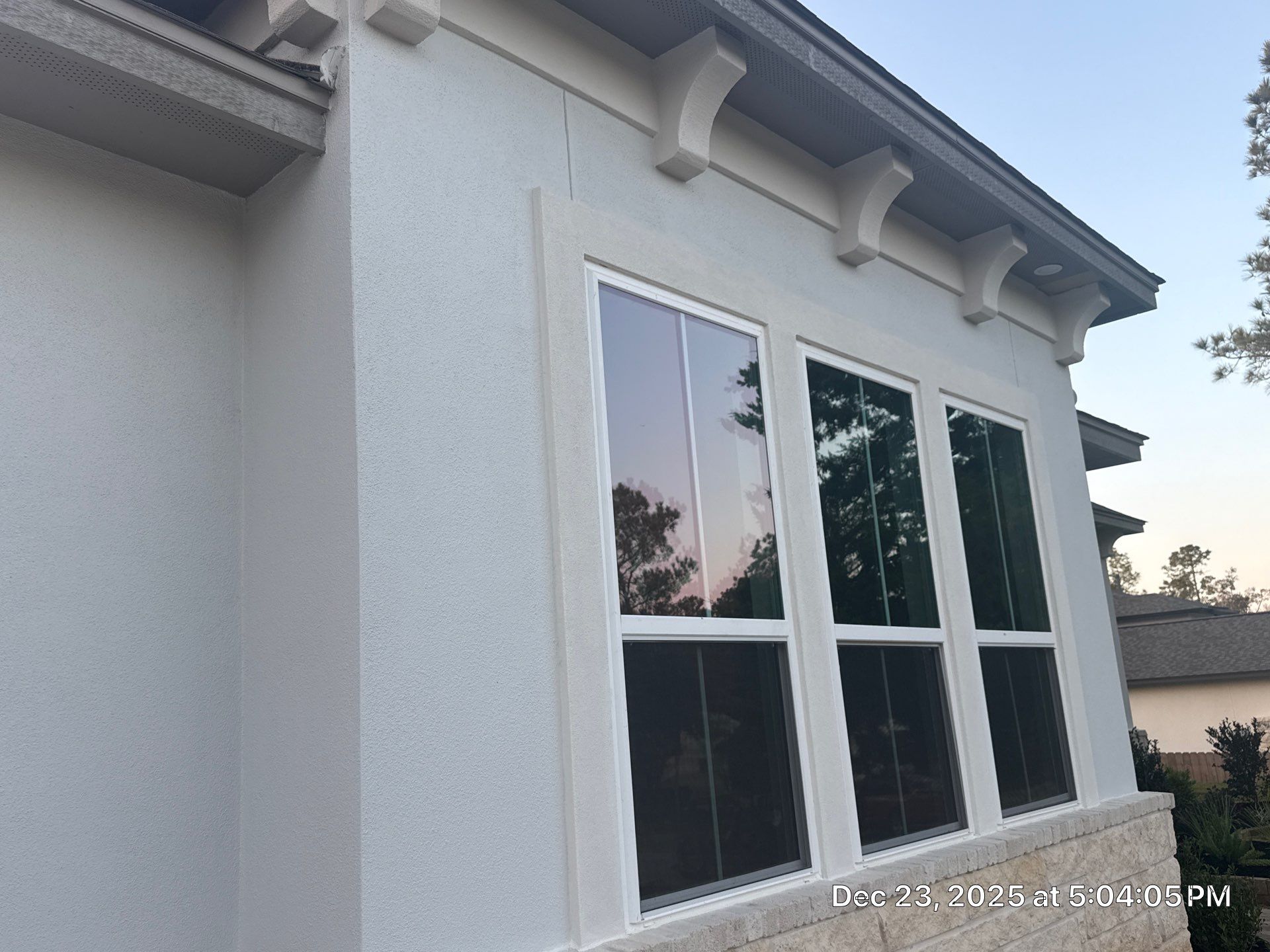 Conroe Elegance: Stucco, Foam Corbels, and Natural Stone Accents. by Apex Conventional Stucco Llc