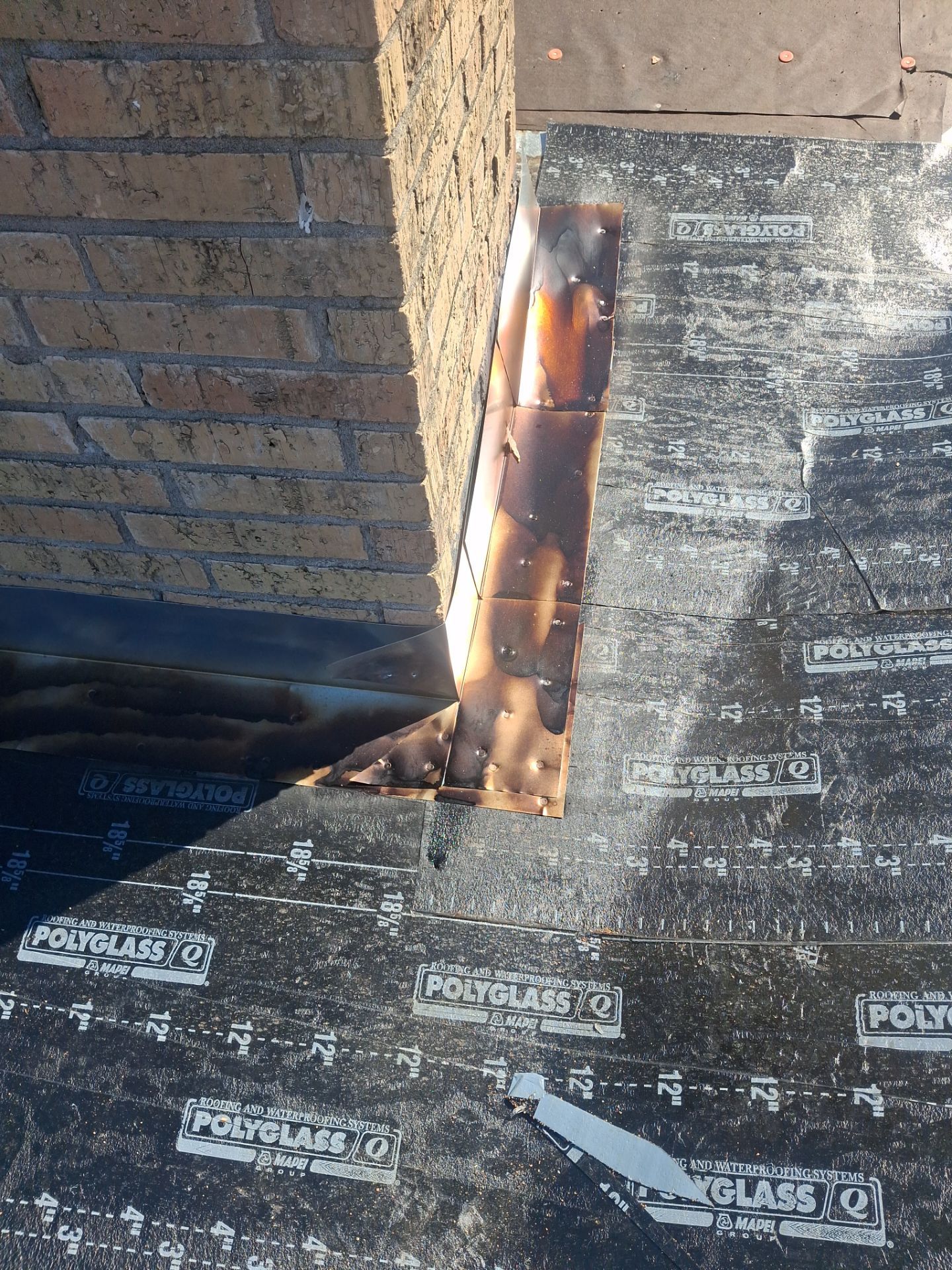Chimneys need a Cricket.  by Bayfront Roofing and Construction