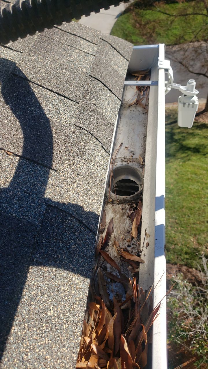 Sara Gutter cleanout using water by Power Wash Masters LLC