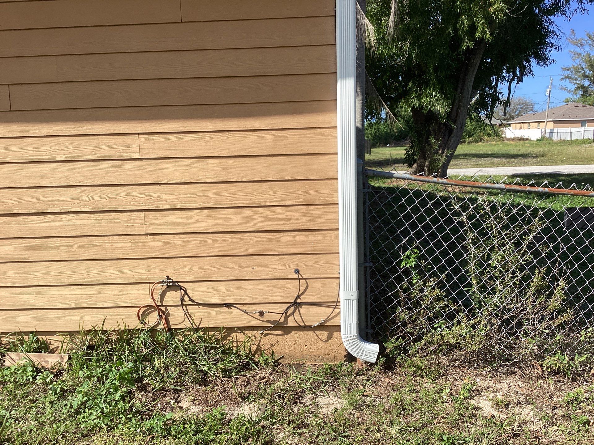 Soffit & Fascia White + New Downspouts by Gutter Professors