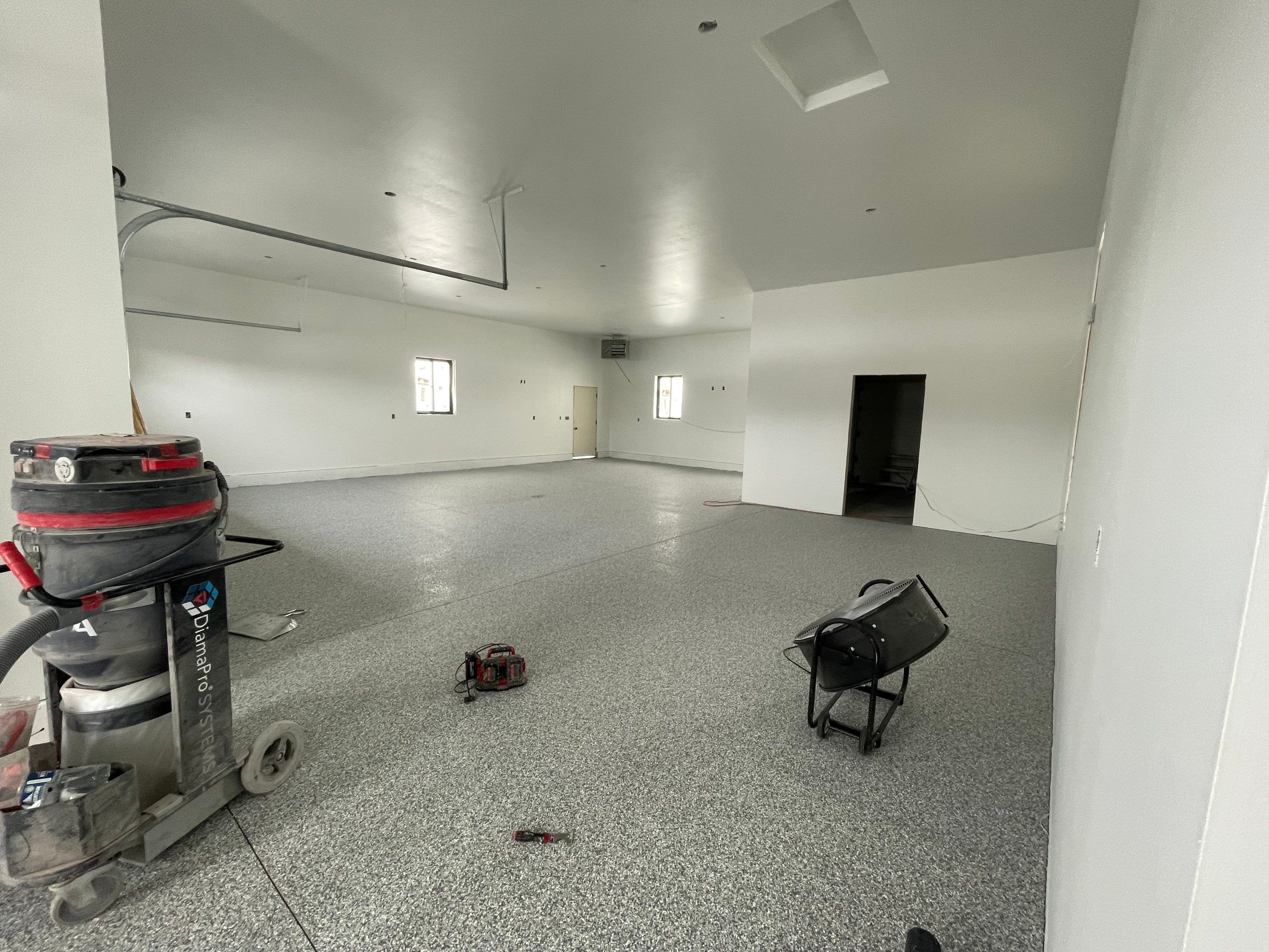 Garage using Slate Stone by Select Painting, Coatings & Garage Cabinets