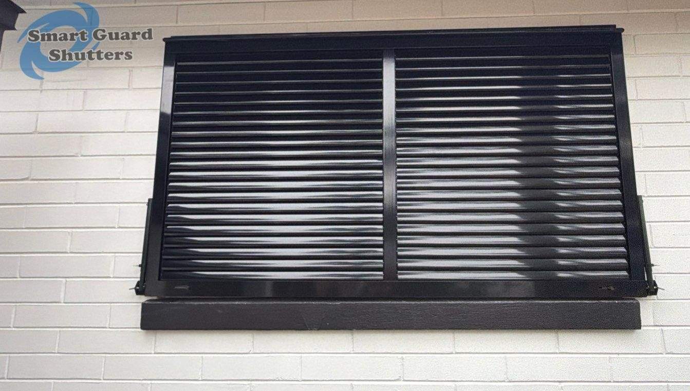 Impact Bahama Shutters in Jet Black by Smart Guard Shutters