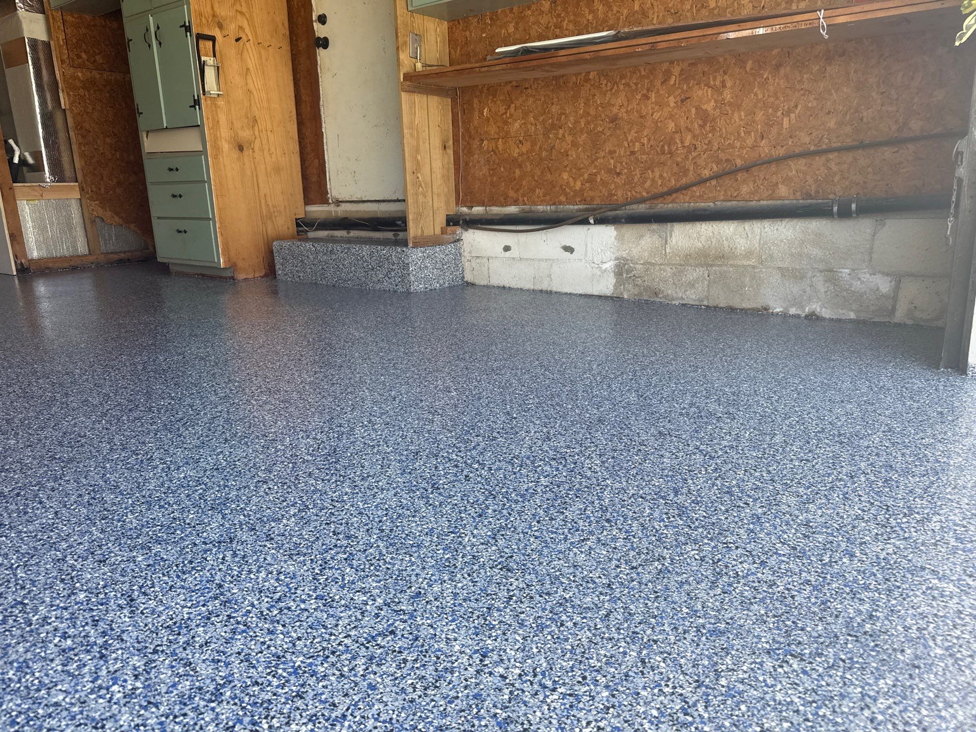 Garage in Midnight by Innovative Concrete Coatings 