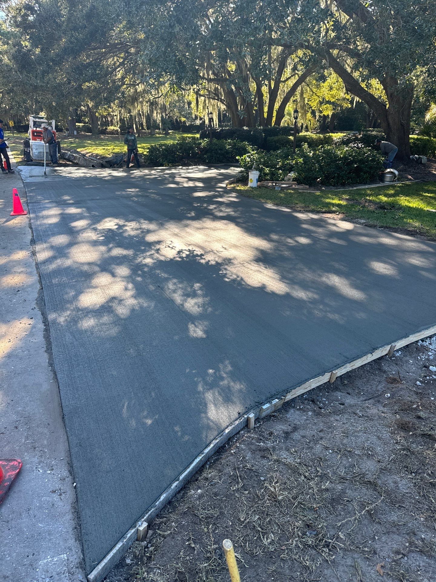 Custom Concrete Driveway with Decorative Paver Inlays in Hilton Head Island by Lowcountry Scapes, LLC
