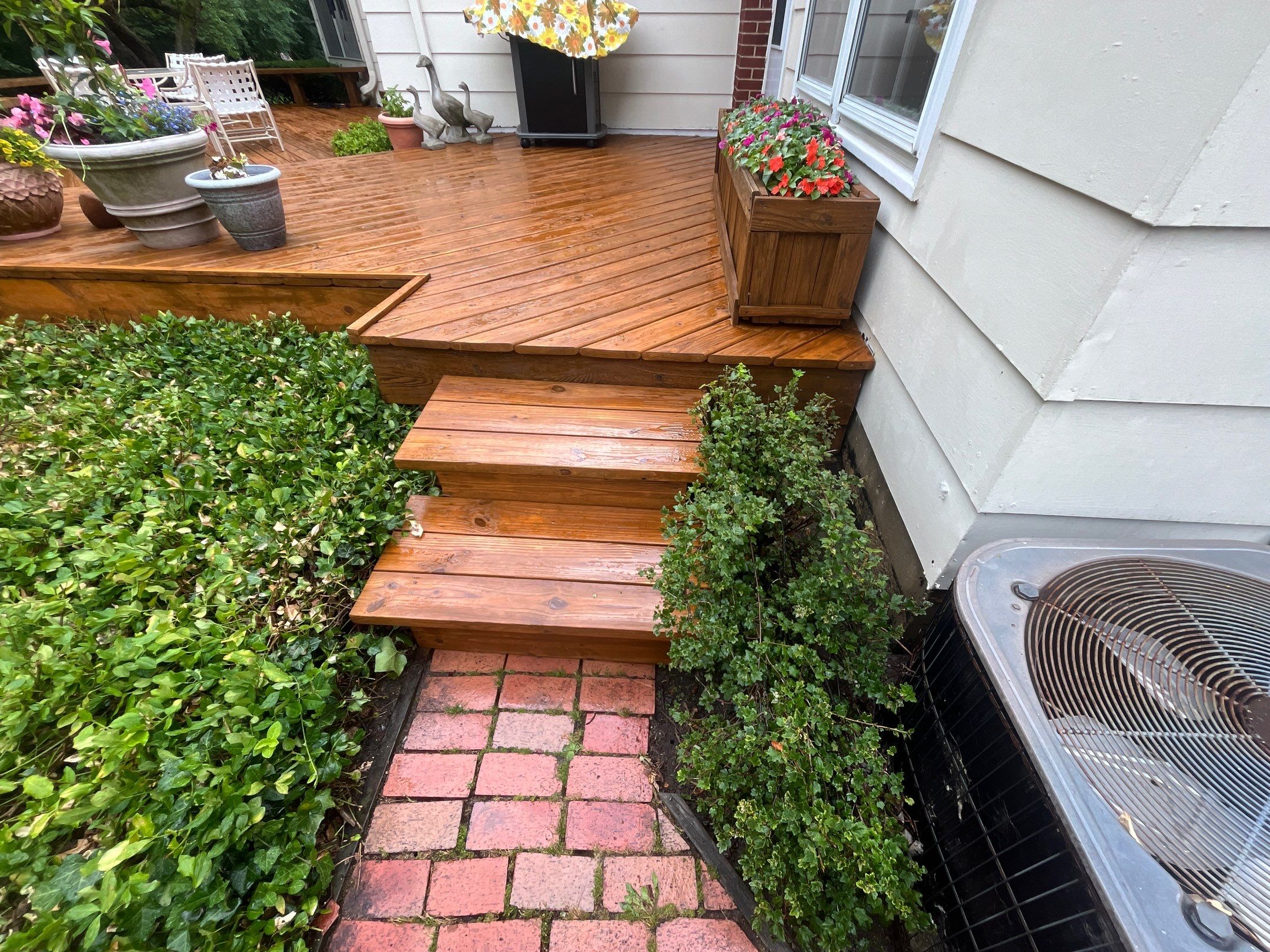 Wood cleaning and staining using Algaecide, soft wash soap by Northern Power Washing LLC.