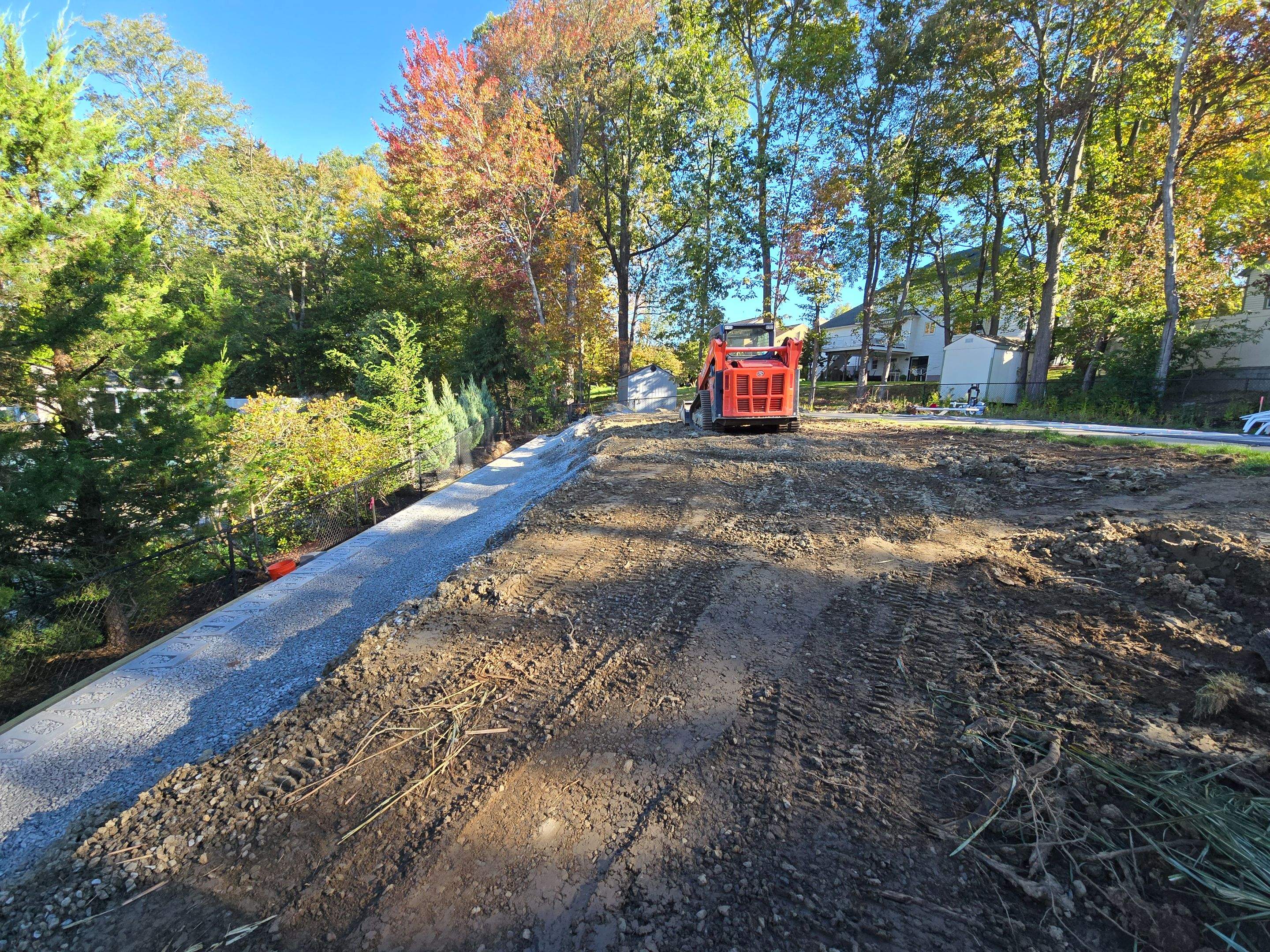 Retaining Wall to Level Backyard  by May Property Management 
