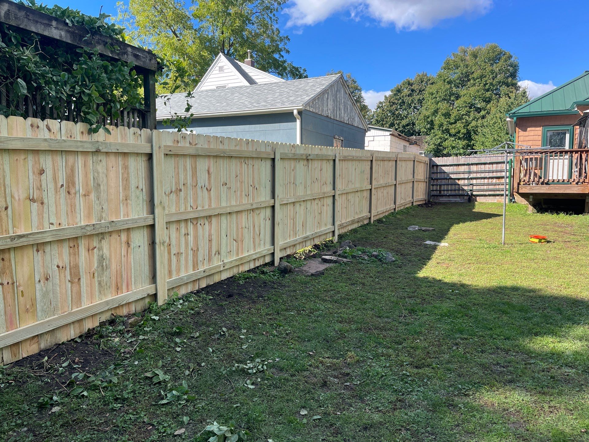 Pressure-Treated Wood Privacy Fence Installation in Waverly, Iowa by Perfect Picket Fence and Stain