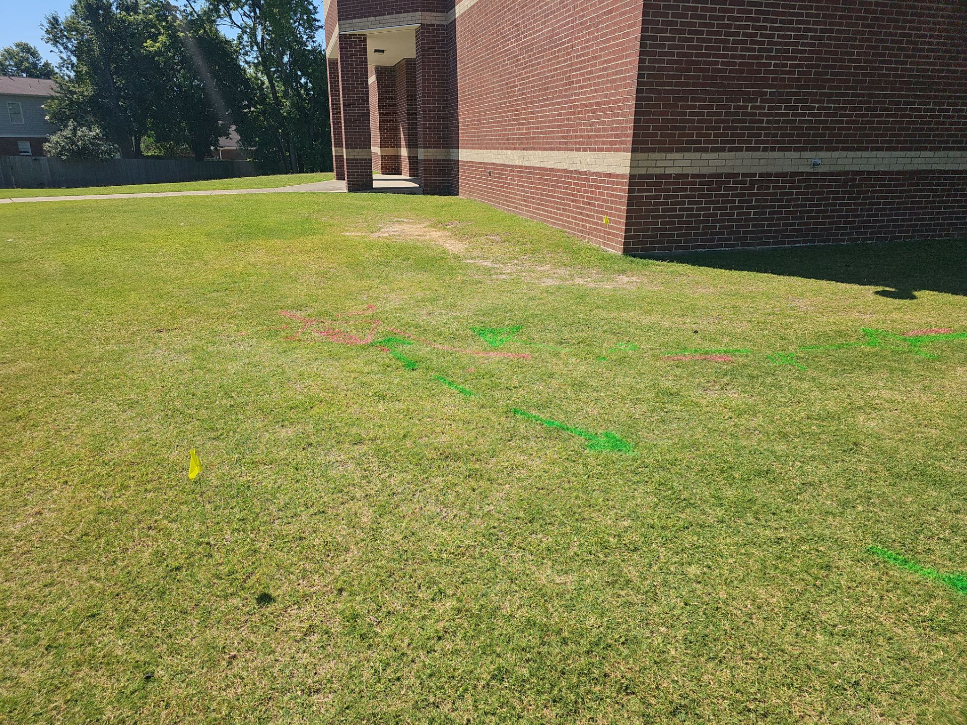 Utility Locating at a school for fence install by Alsip Locating Service, LLC