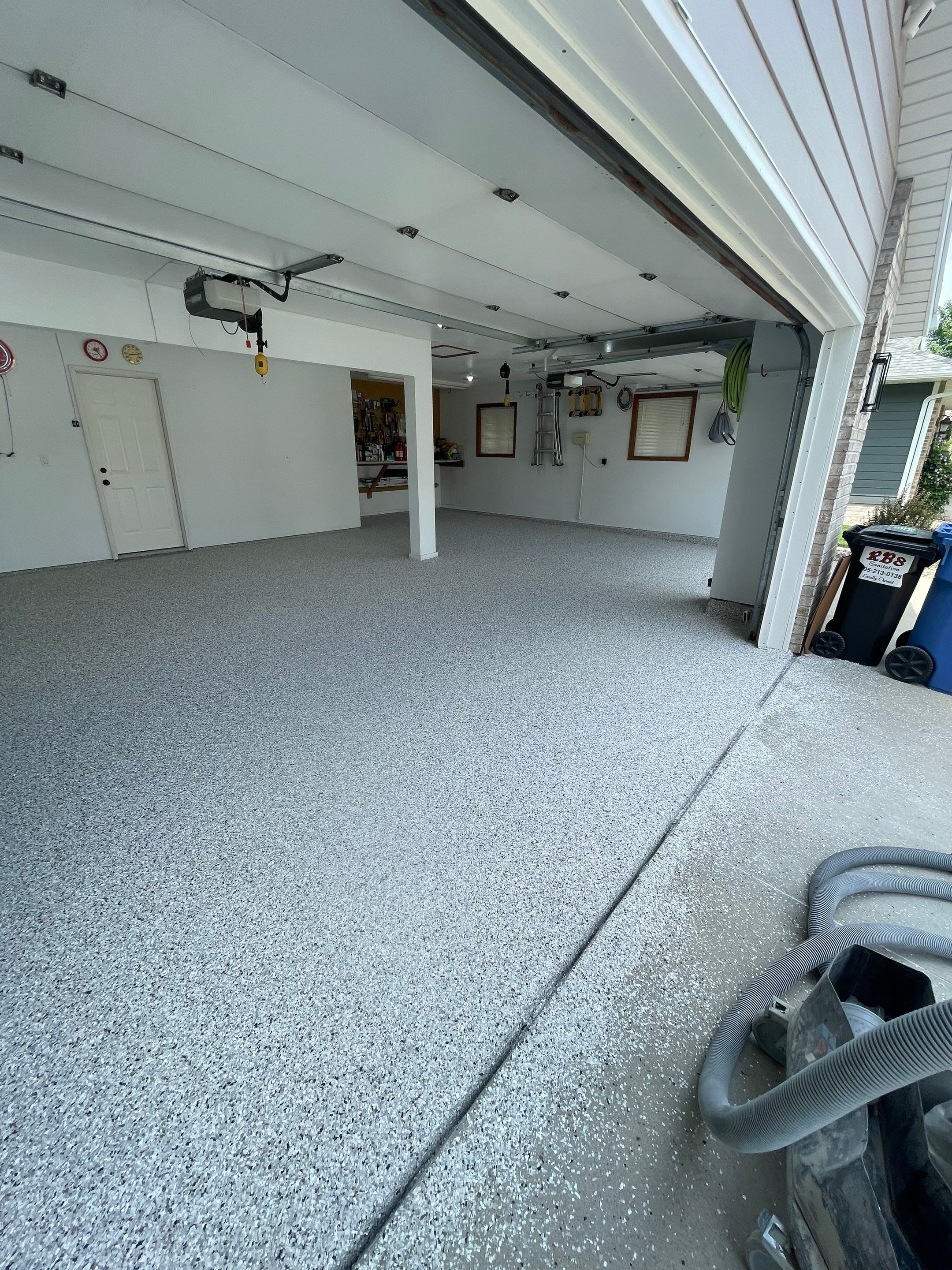 Multi-Car Garage Concrete Coating with Coyote Flake Finish in Sioux Falls by Select Painting, Coatings & Garage Cabinets