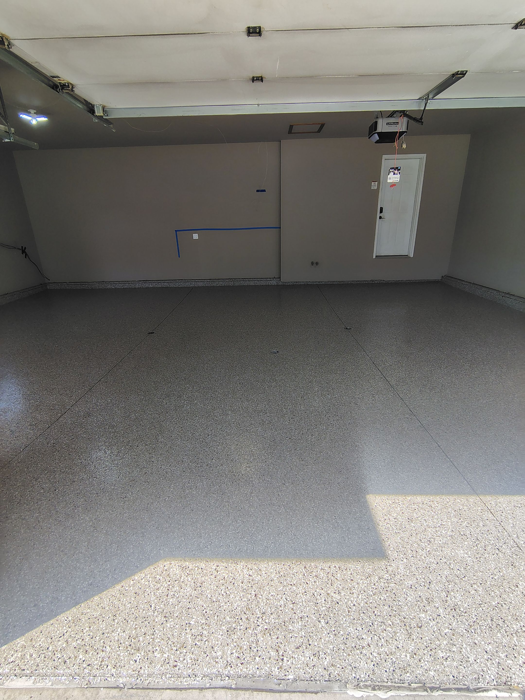 Sioux Falls Garage Concrete Repair and Epoxy Flake Floor Coating by Select Painting, Coatings & Garage Cabinets