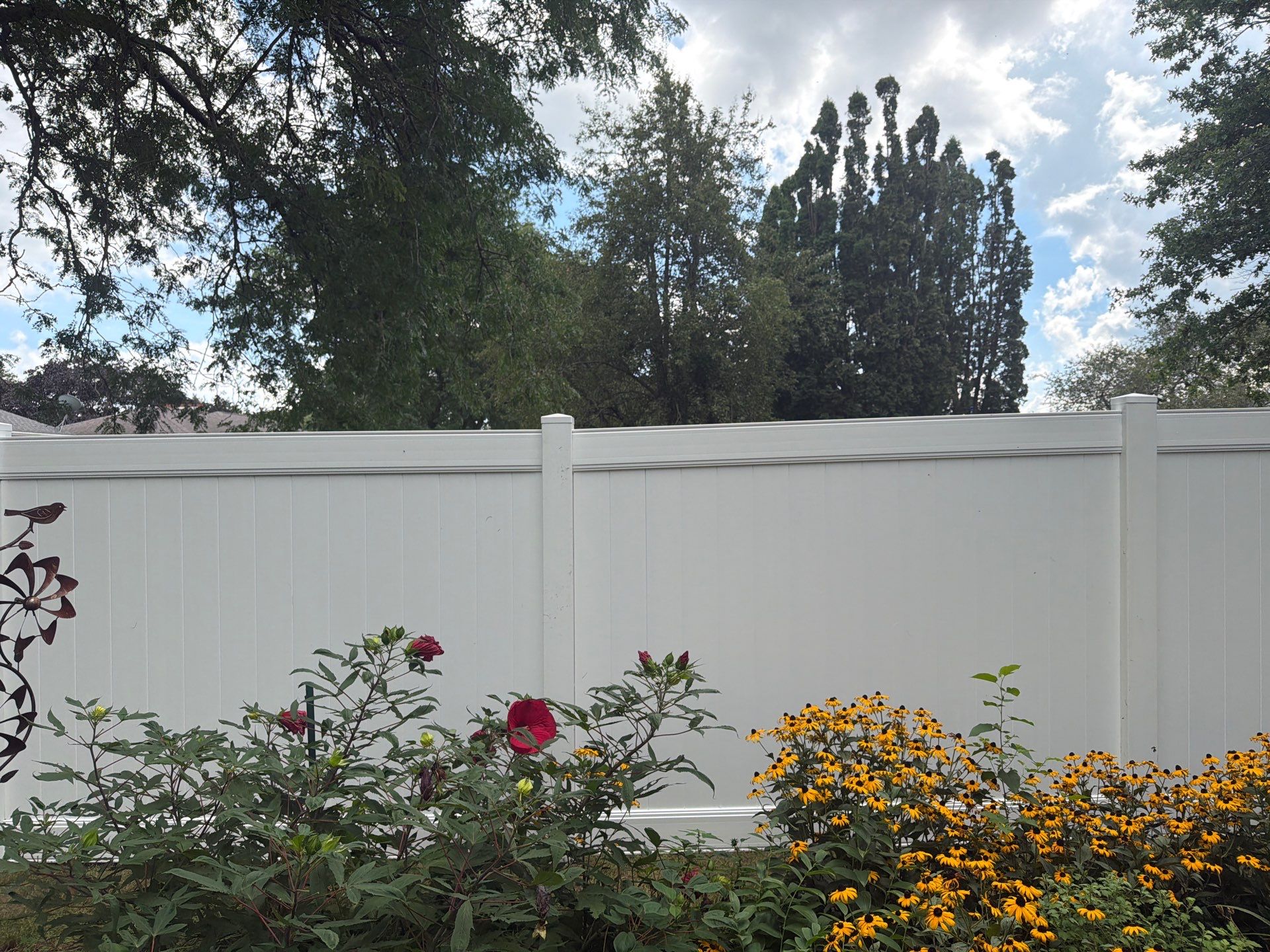 Residential White Vinyl Privacy and Black Chain Link Fencing in Jesup by Perfect Picket Fence and Stain