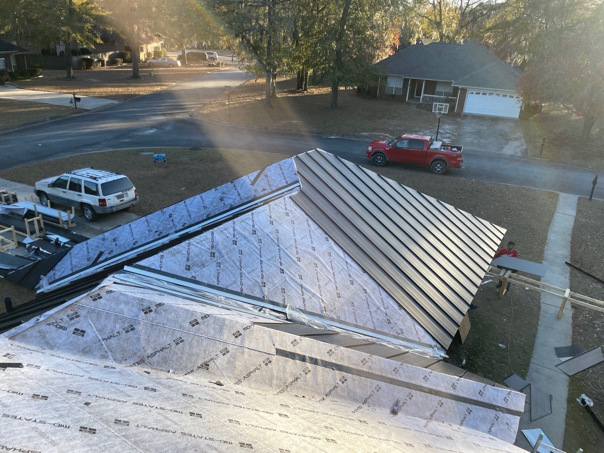 Residential Roofing Installation using Benton 26Ga 1inc Snapcock Metal Roof KYNAR Matte Black by Talya Roofing