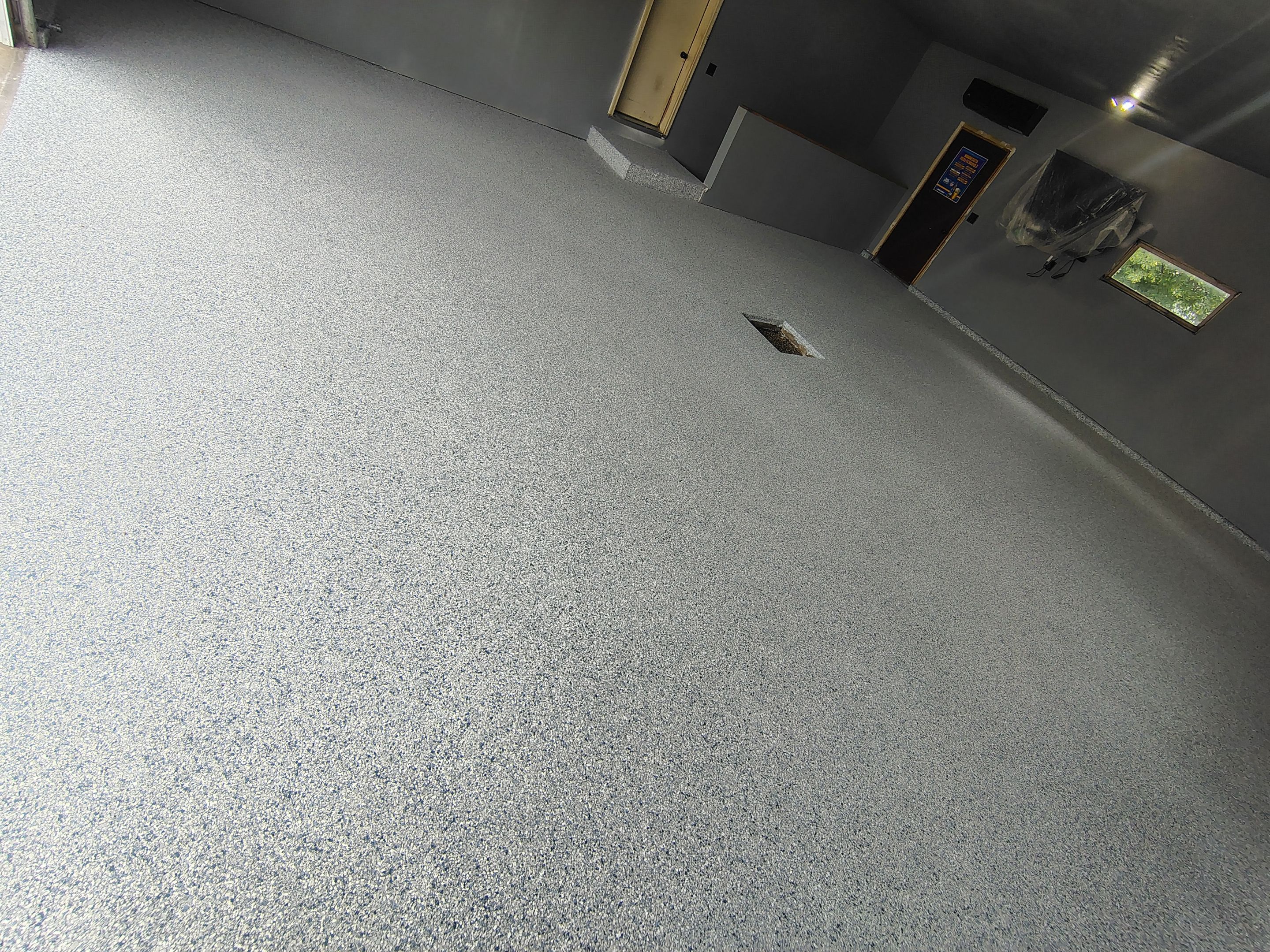 Garage Floor Concrete Coating and Surface Restoration in Colman by Select Painting, Coatings & Garage Cabinets