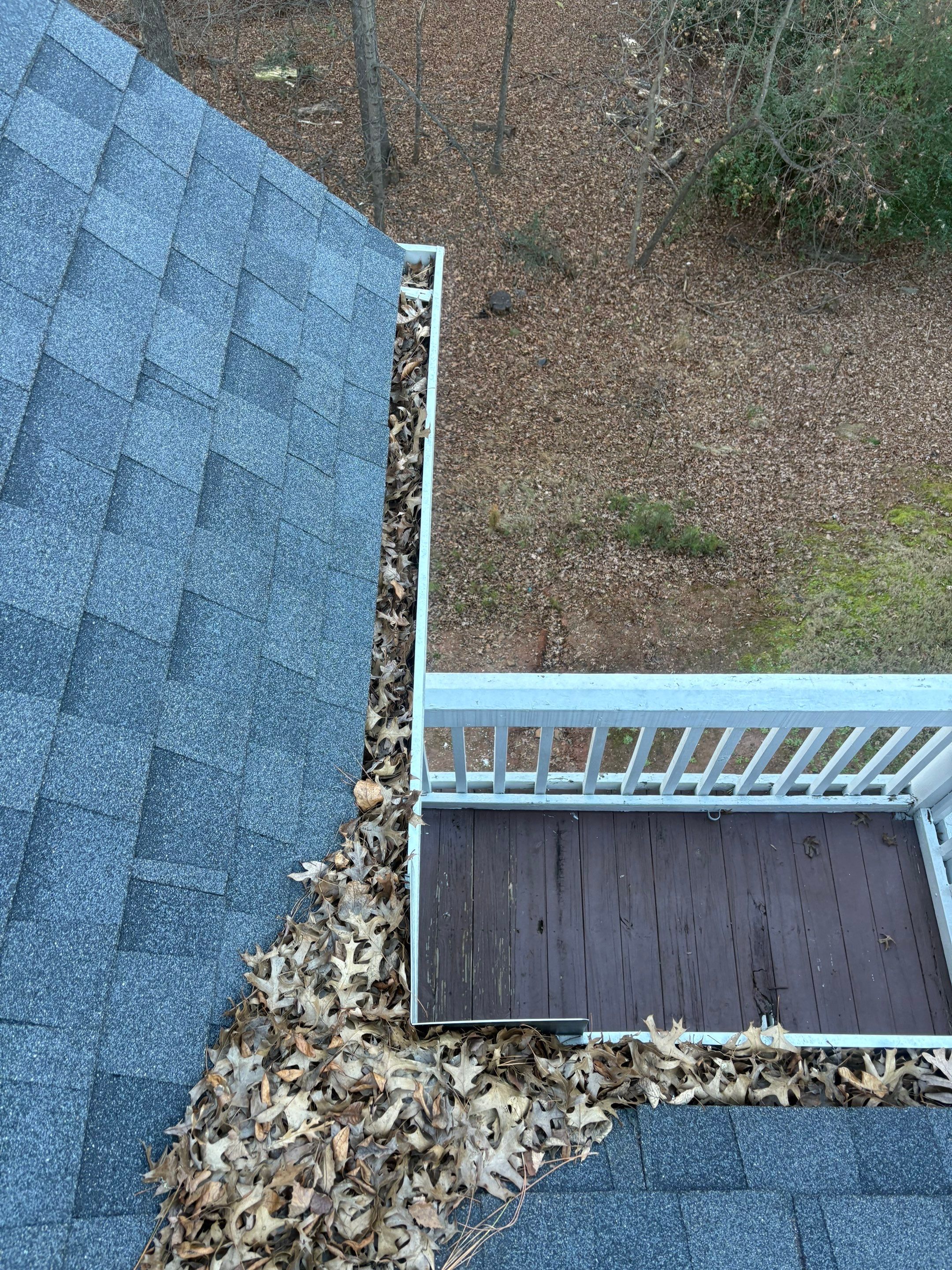 Commercial gutter cleaning Alpharetta & Roswell before photo with filled gutters