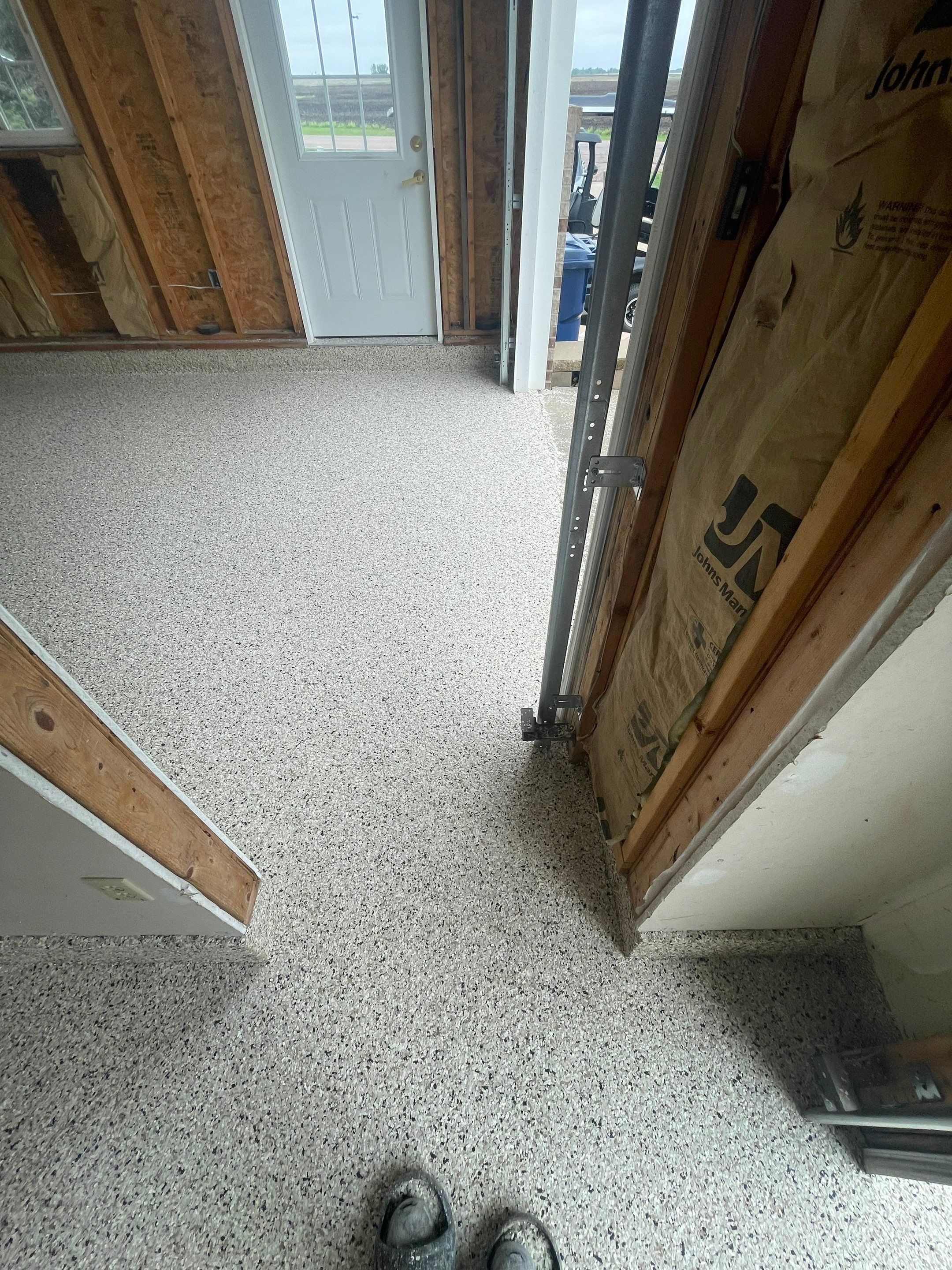 Speckled Epoxy Floor Coating Installation for Centerville Residential Garage by Select Painting, Coatings & Garage Cabinets