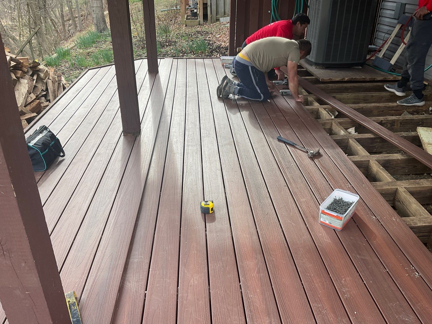Deck Installation using New Composite Deck Board by Alpha Design Services