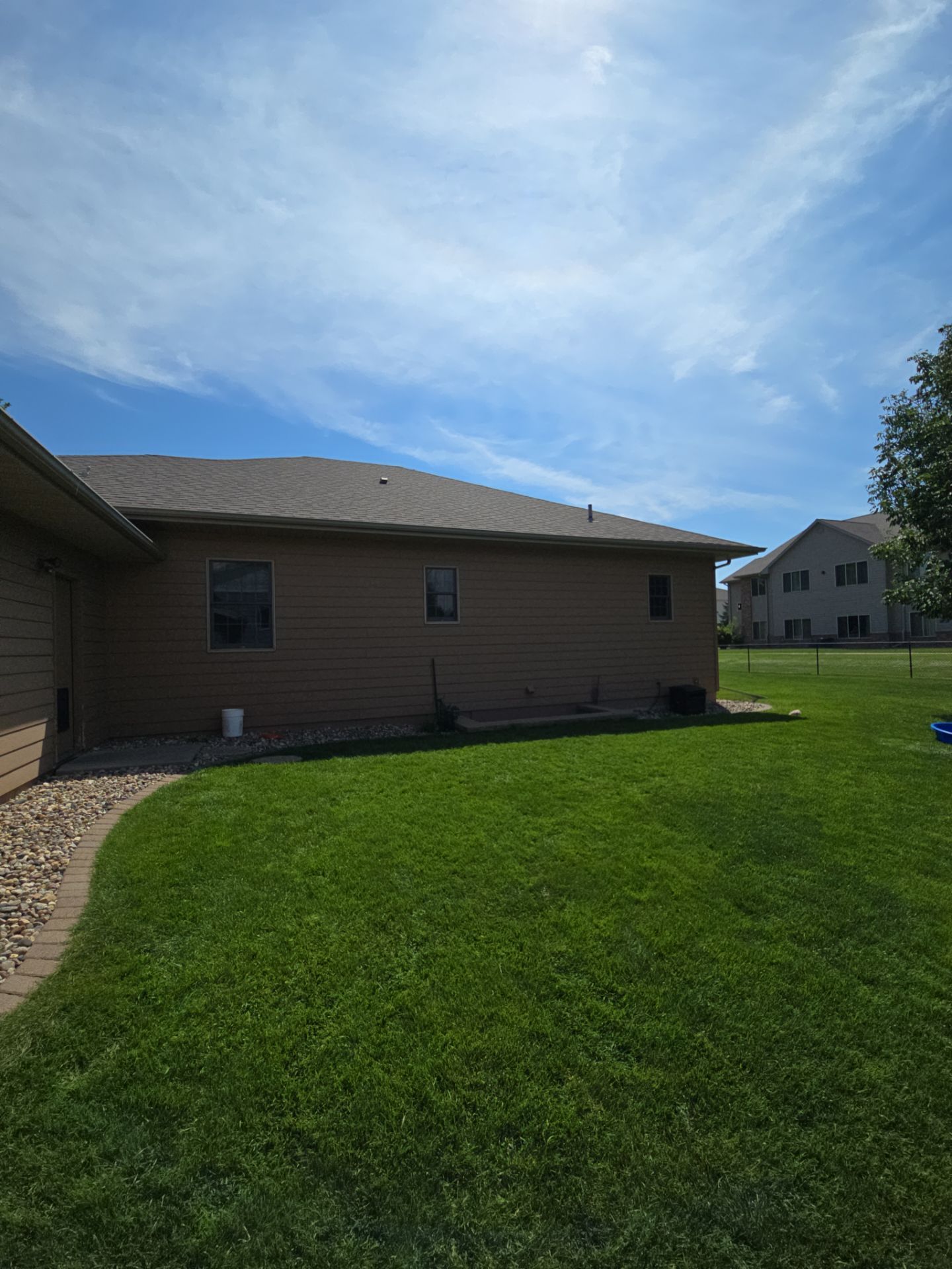 Sioux Falls Residential Exterior Door and Siding Refresh by Select Painting, Coatings & Garage Cabinets