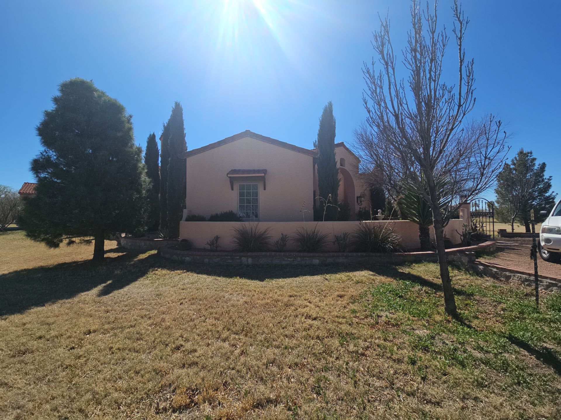 Exterior Painting with Stucco Damage by Regal Renovate