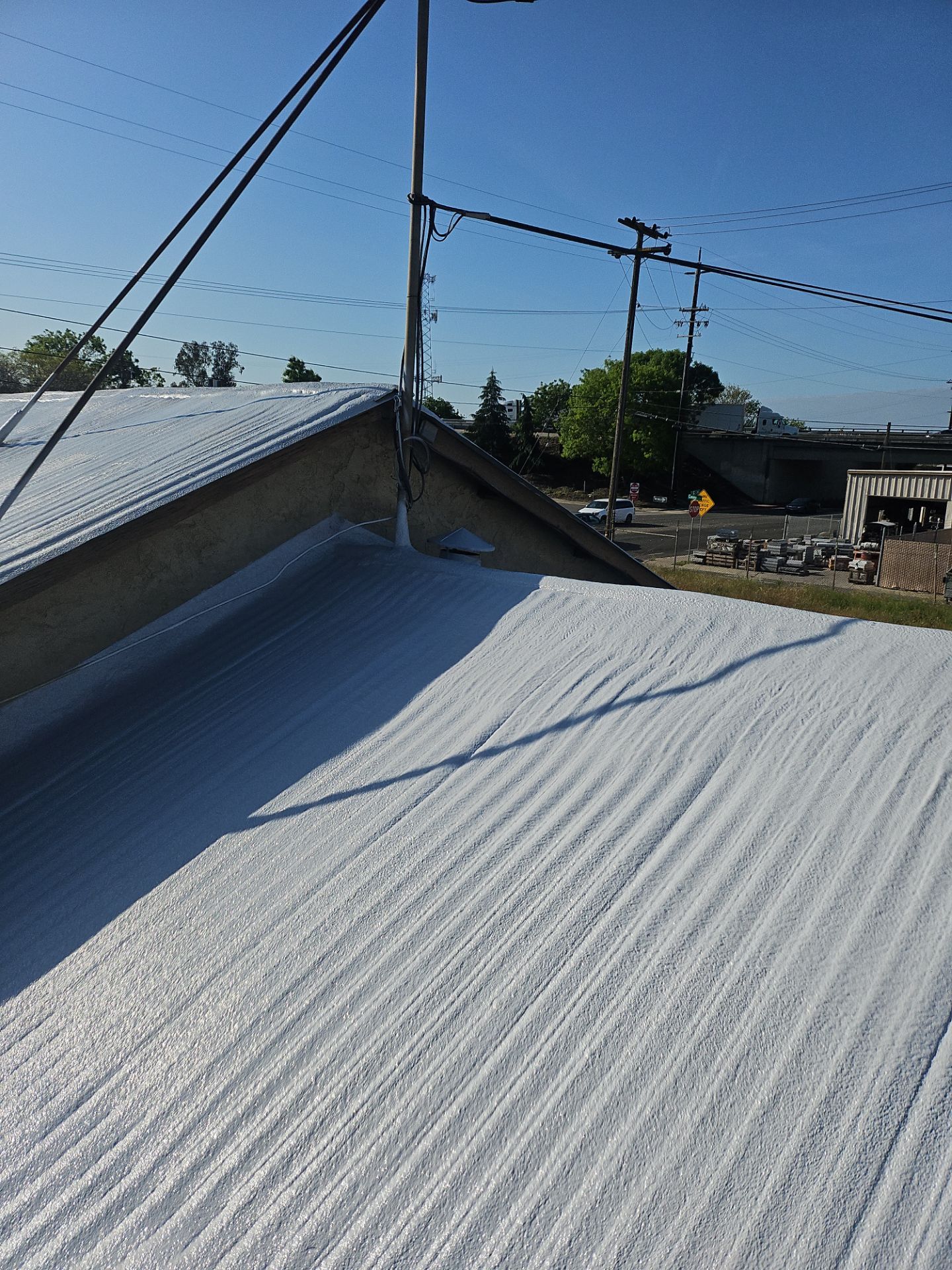 Spray foam and coatings using Conklin Benchmark/PUMA XL by Straight Edge Roofing Inc