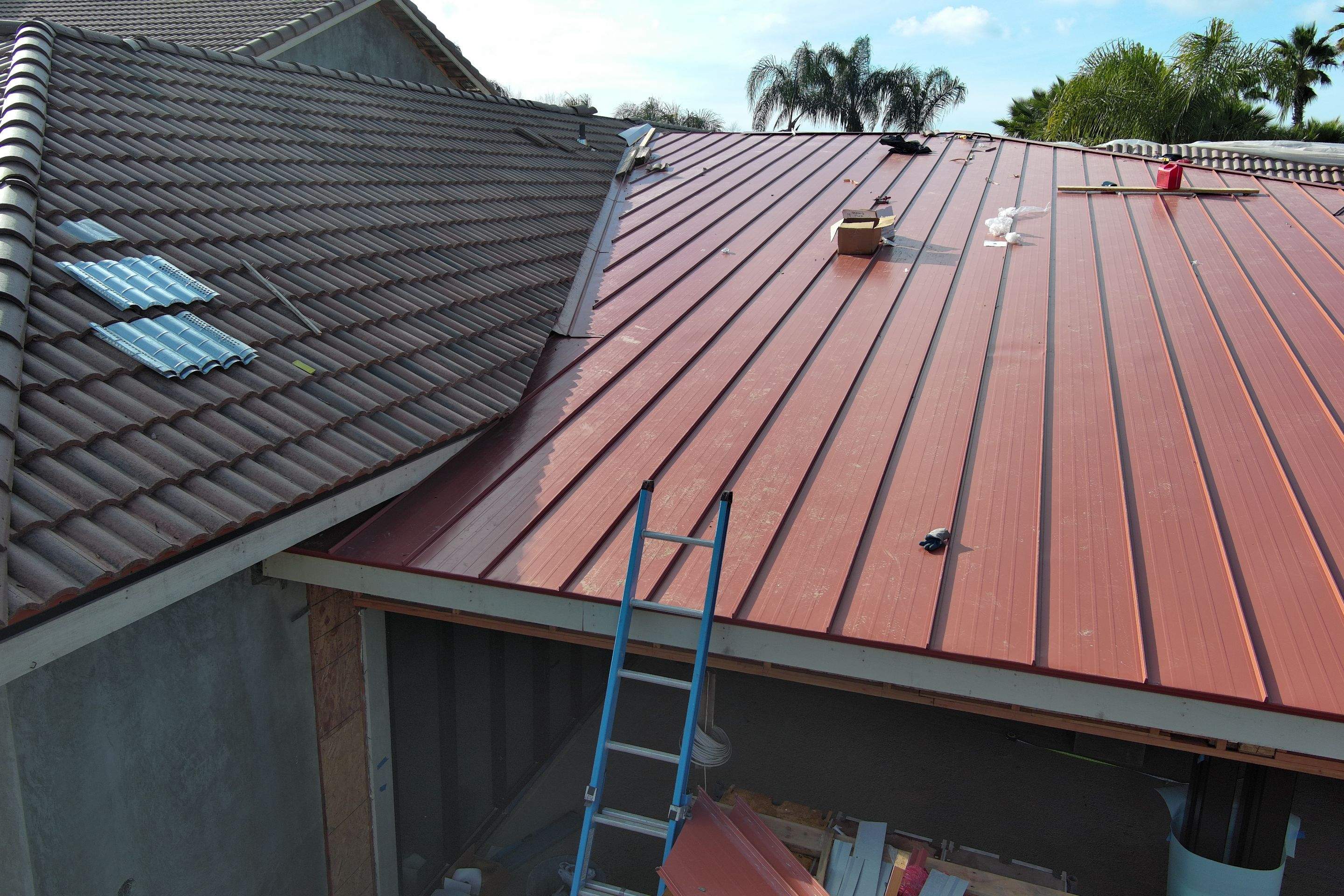Tile, Metal, and TPO roofing project (new construction) by Straight Edge Roofing Inc