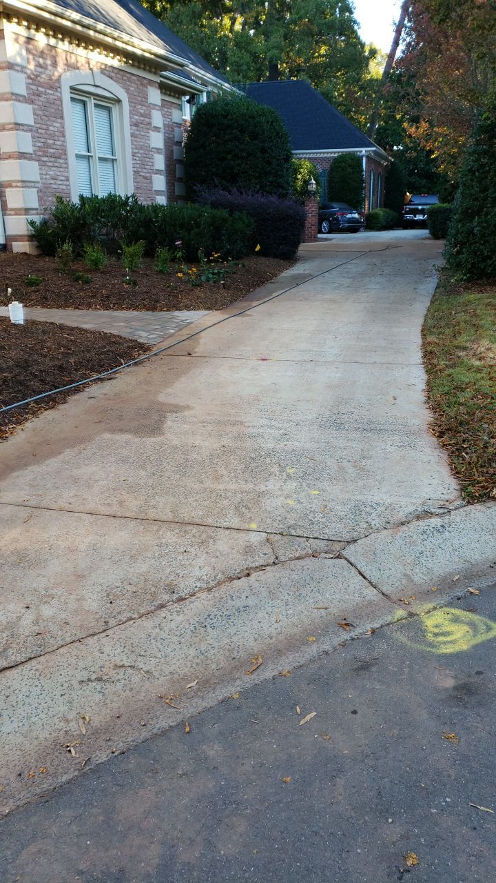 Driveway Clean using cleaner by Power Wash Masters LLC