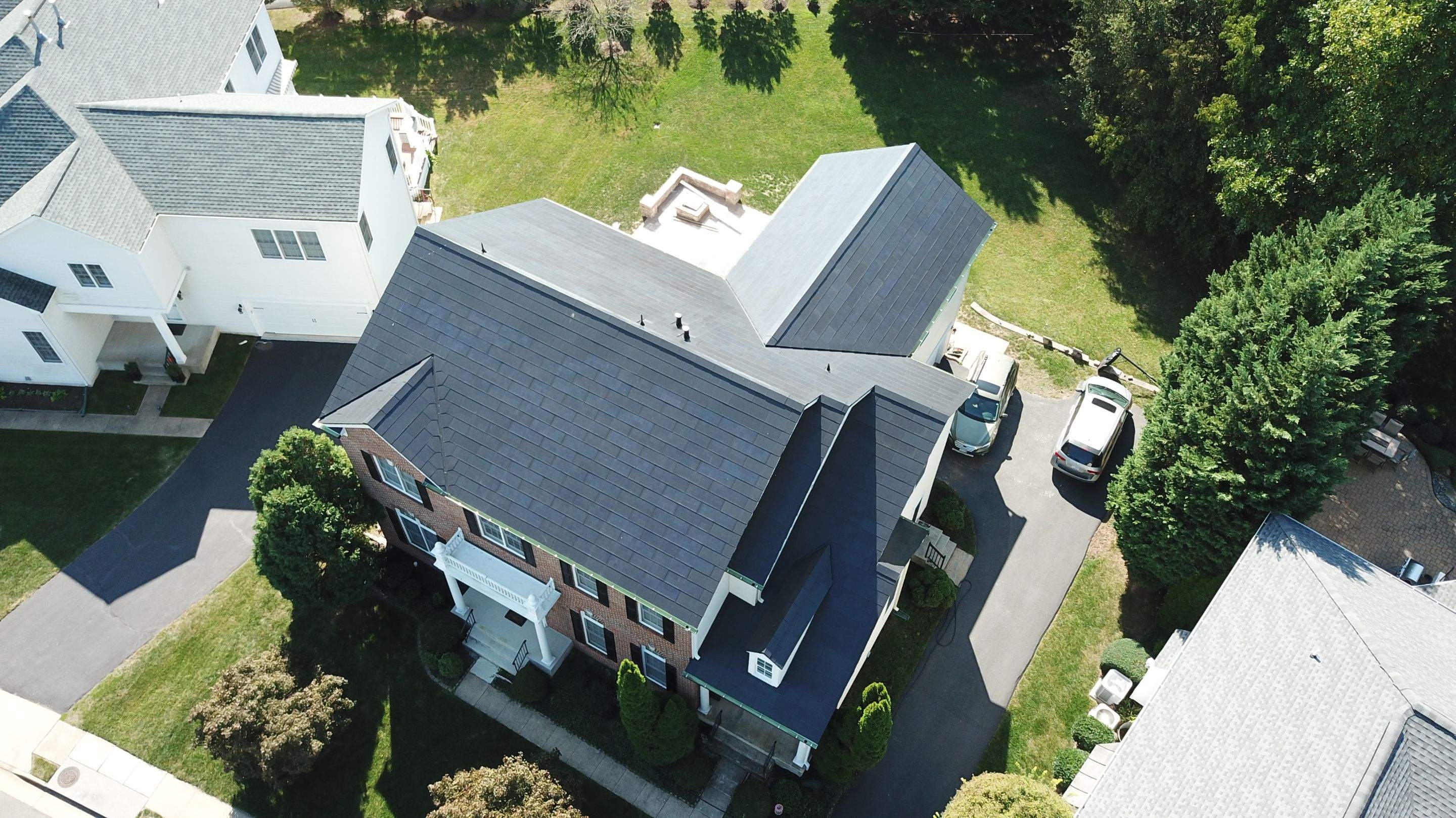 Tesla Solar Roof Replacement using Tesla Solar Roof V3 tiles by American Home Contractors