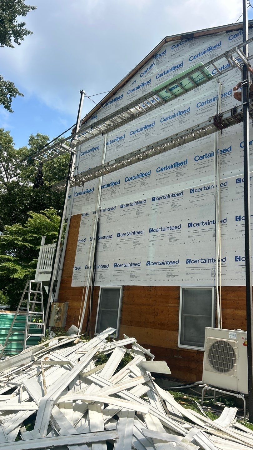 Siding Renewal Using Provia Cedar Peaks D 4.5 in Woodgrain and Tando Brick Panels by DiGiorgi Roofing and Siding Inc