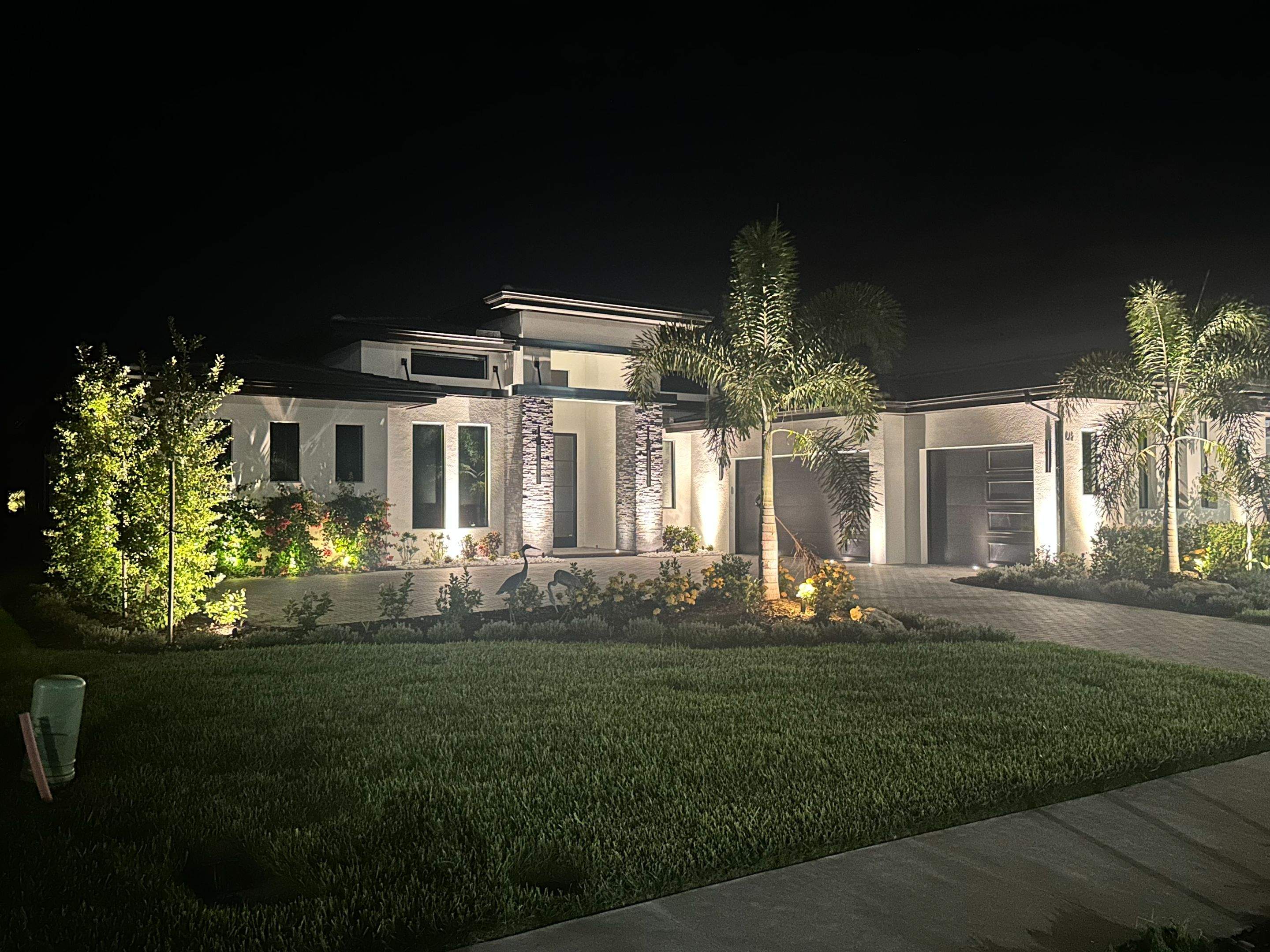 Architectural and Landscape Lighting Installation for Modern Sarasota Home by Illuminate Landscape Designs