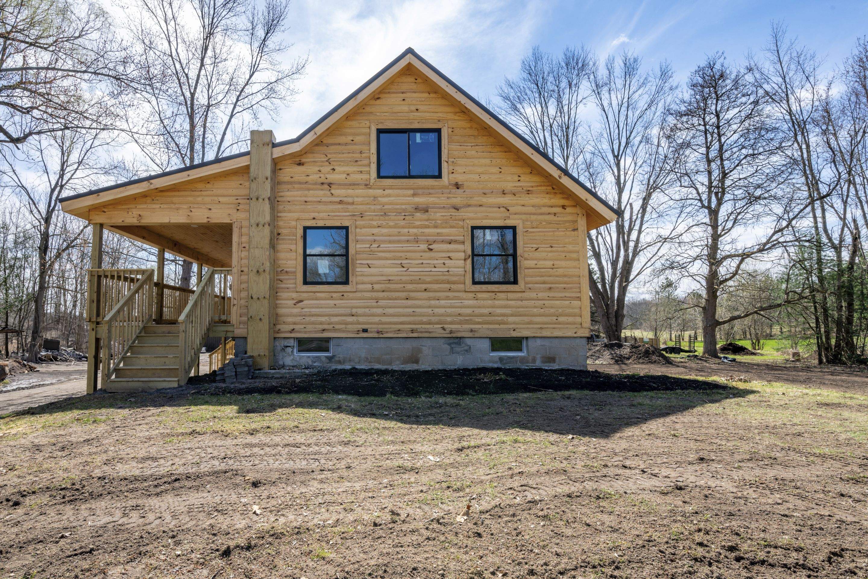 New Addition to Home using Log Cabin Siding  by Horst Custom Homes 