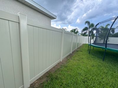 Vinyl Fence Installation using Tan Vinyl Privacy Fence