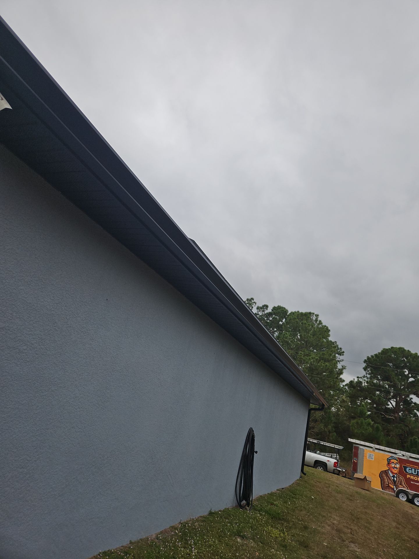 Black Seamless Gutters & Soffit/Fascia in Lehigh Acres FL by Gutter Professors