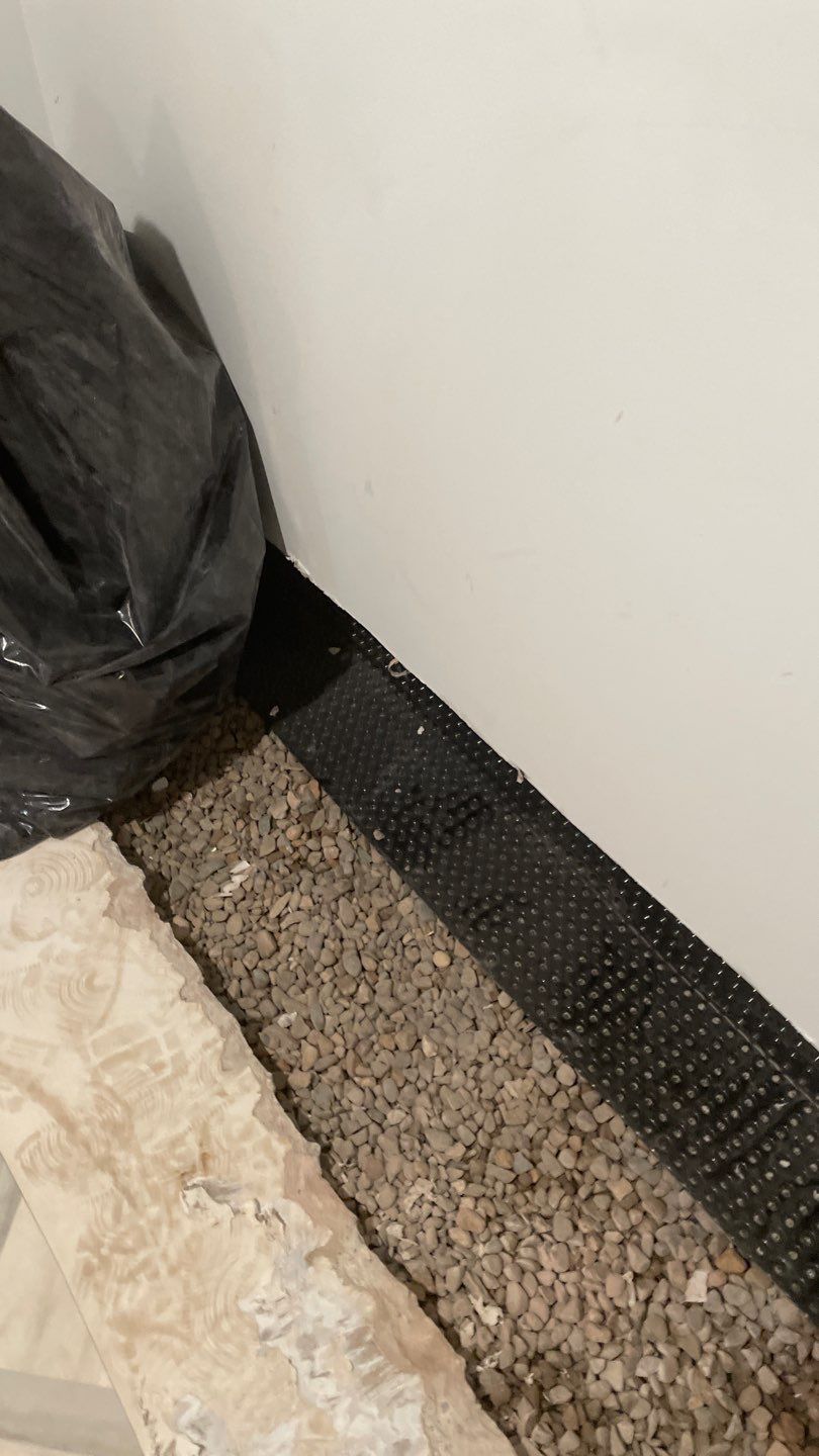 Interior Drain Tile & Buried Discharge in St. Anthony, MN by Waterproofing Northeast