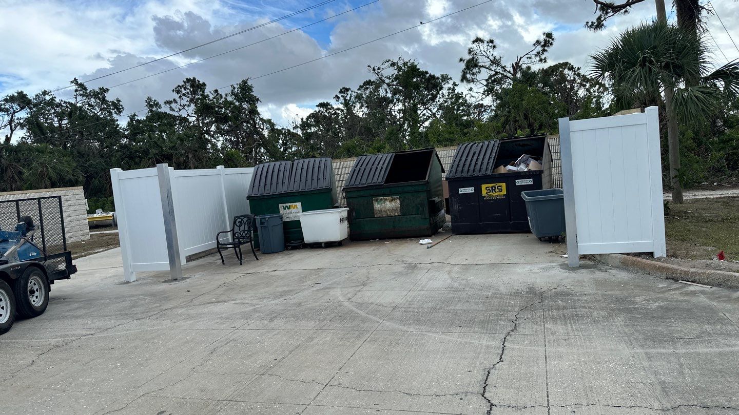 Commercial Chainlink and Vinyl Fence With Aluminum Framed Gates On Dumpster Enclosure by Asap fence and gates, LLC